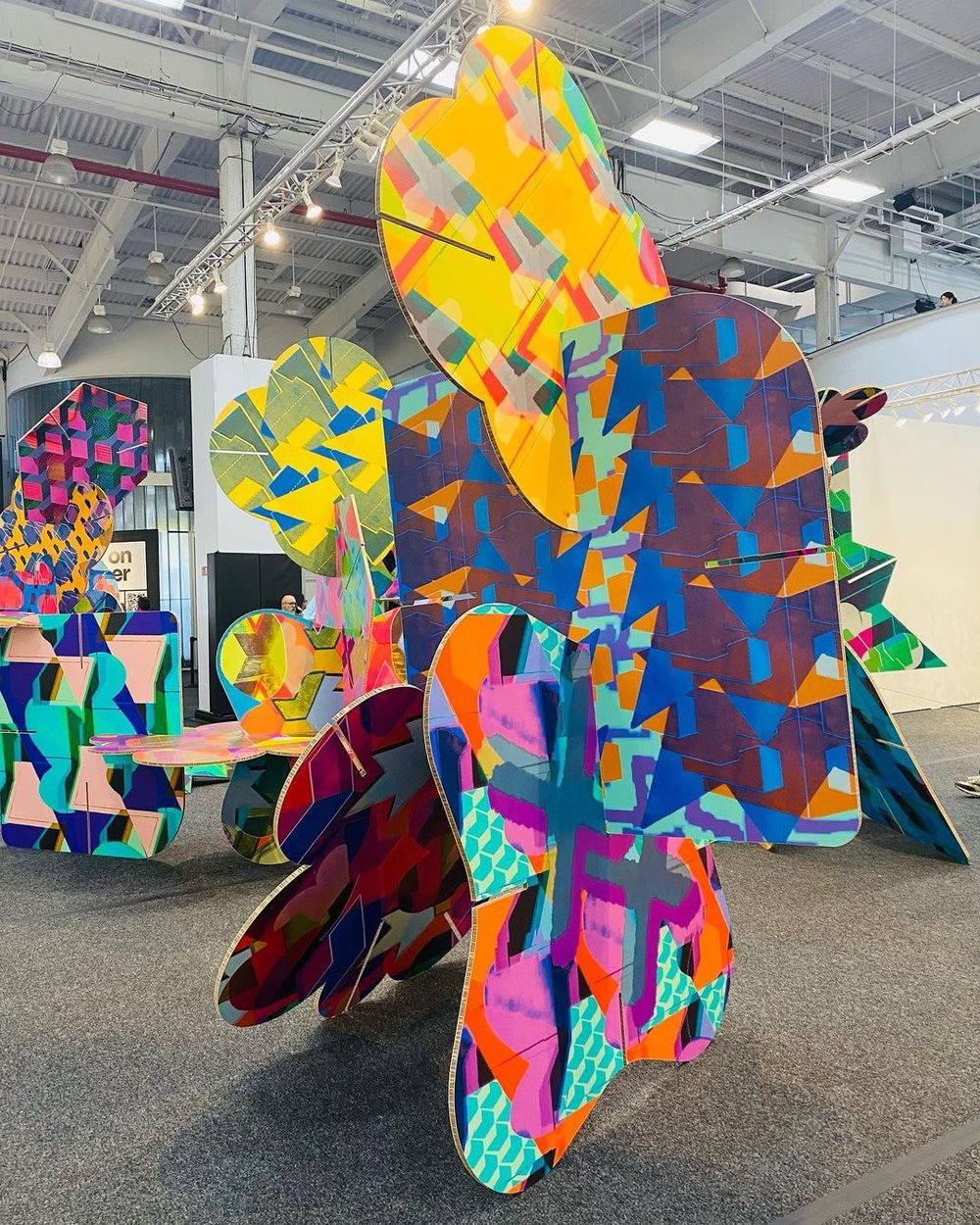 KIN CONNECTION, 2022, lasercut vinyl and honeycomb cardboard, approx 30 x 12 x 10ft