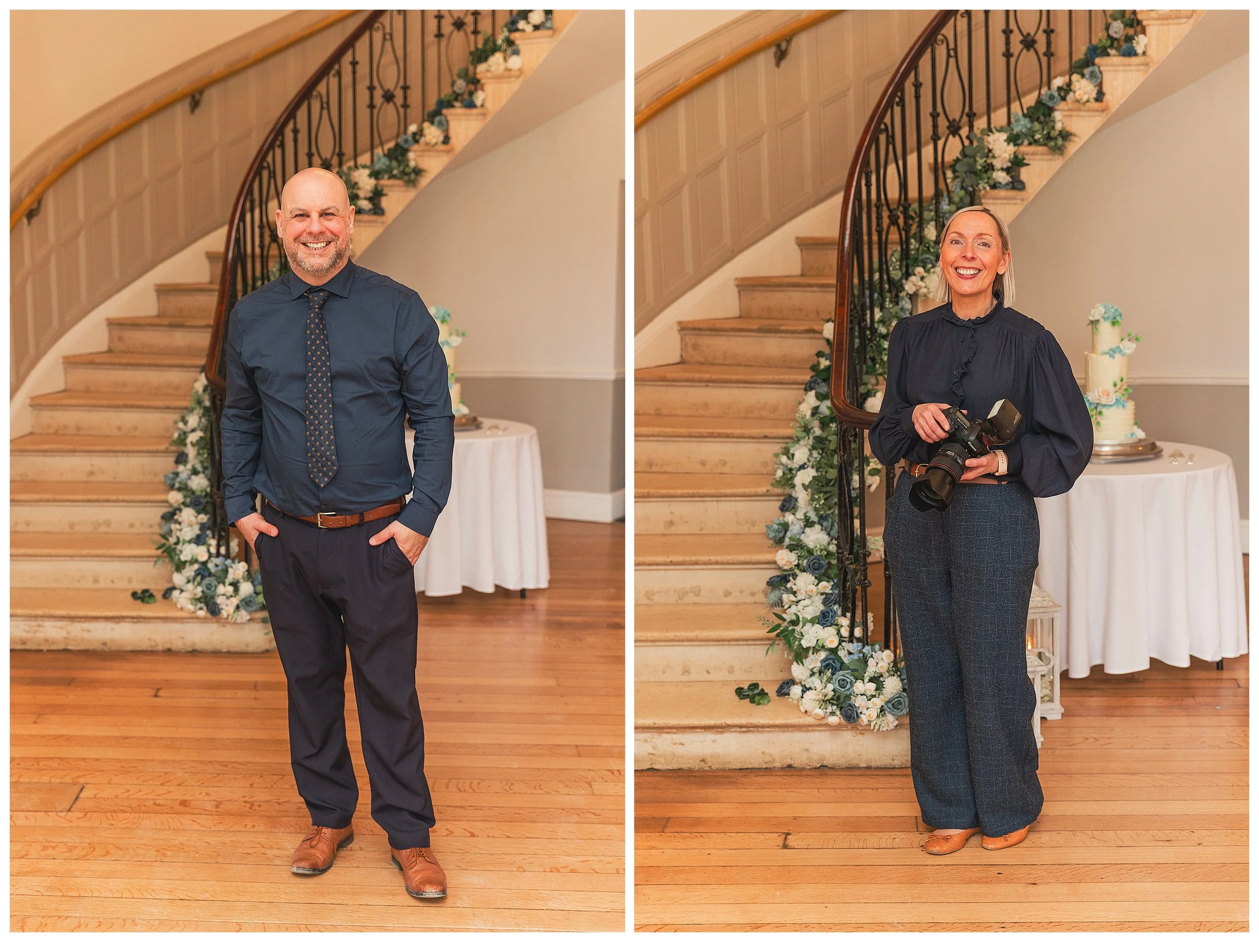A male photographer dressed in navy next to a female photographer dressed in navy, both are standing in front of a sweeping staircase