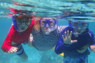 Hayden and her boys snorkeling in the Maldives.