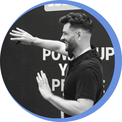 A side profile shot of Roy presenting with a smile on his face