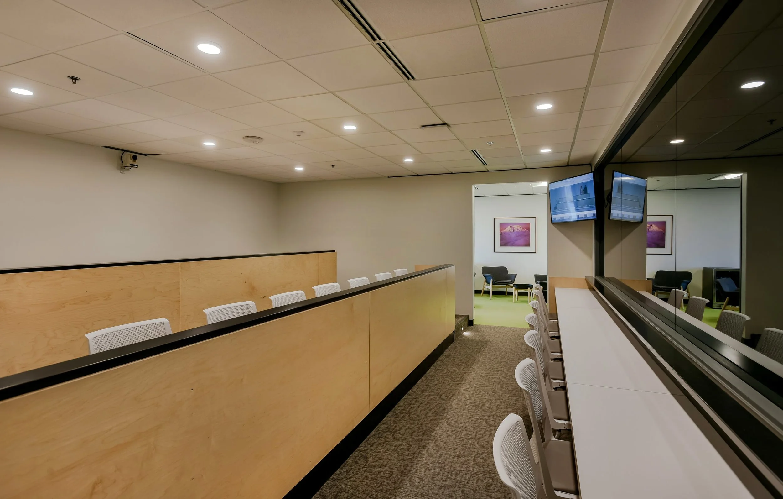 Our observations room includes tiered seating, monitors, and an adjacent break lounge.