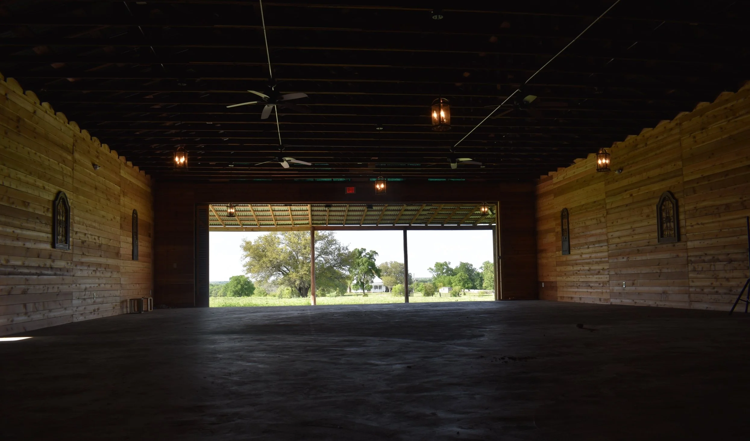 Ceremony Barn with Sliding Doors Fully Open. Provides Beautiful View of House.