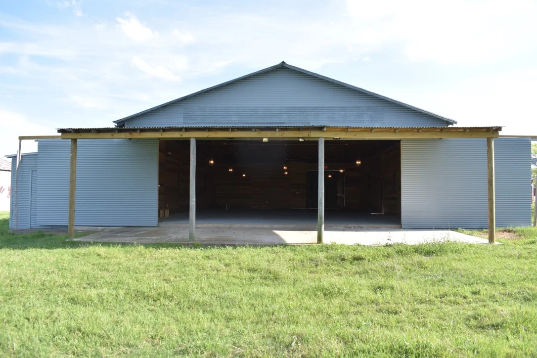 View of Covered Patio and Sliding Doors to Interior. Doors Open to Full Width of Wall.