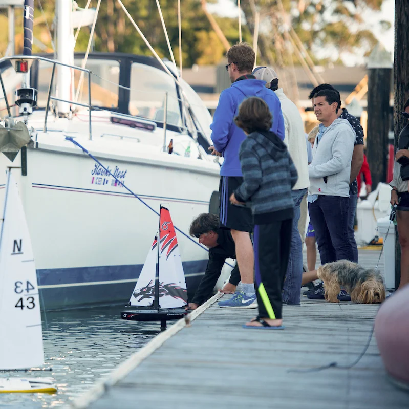 The Cove at Tiburon residents enjoy a remote control sailboat regatta in the private marina.