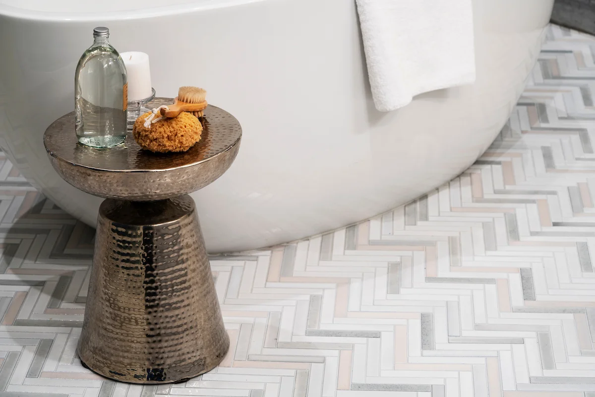 Waterworks luxury fixtures and Waterworks ceramic tile flooring in the bathrooms.