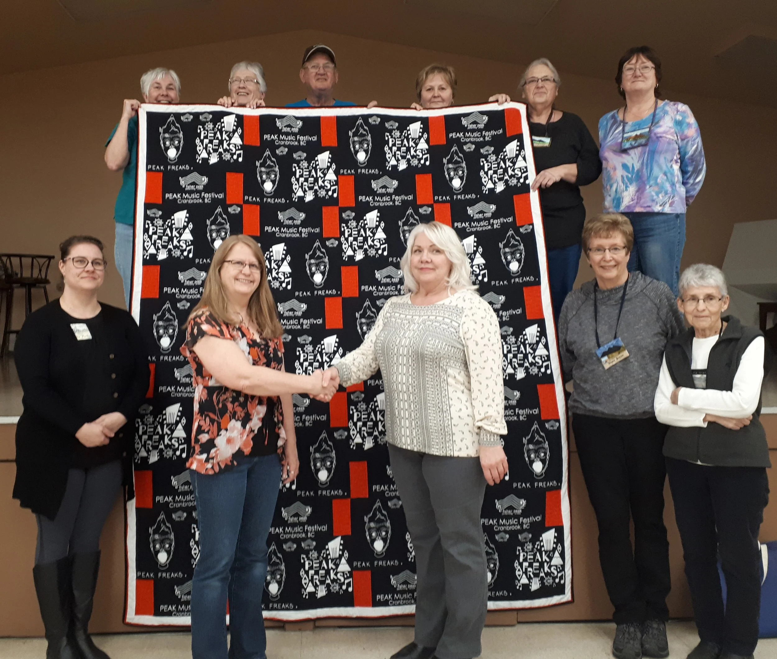 On January 8, 2019 Cranbrook Quilter’s Guild ladies present custom quilt to FPPAS Directors Maureen Frank (centre right) and Howie Mason (top centre).