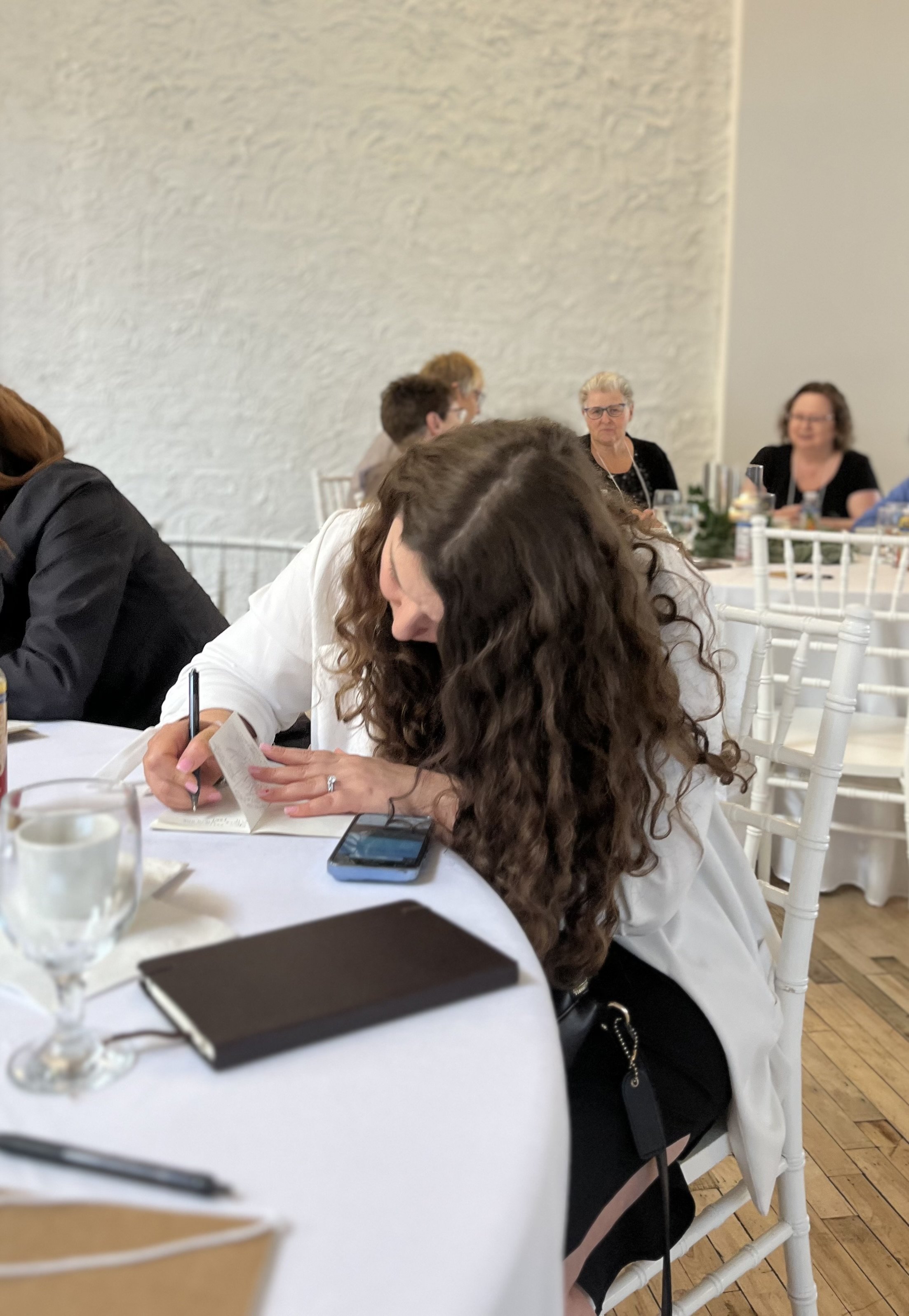 Woman-writing-journal-reflective-exercise-legacy-workshop.jpeg