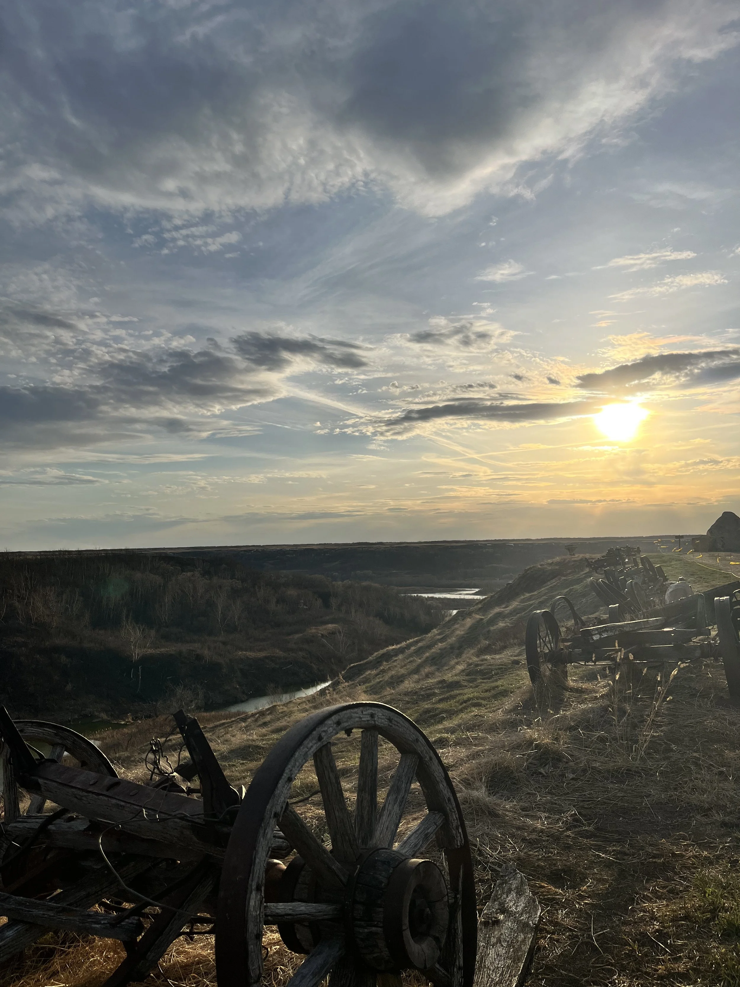 Vintage farm implements along coulee feeding into North Saskatchewan River at Blue Sky Ranch near Langham, Saskatchewan - Photo by Karla Combres