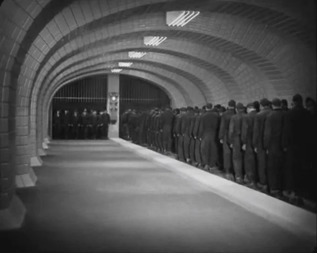 Trudging to work. From Metropolis (1927), dir. Fritz Lang.