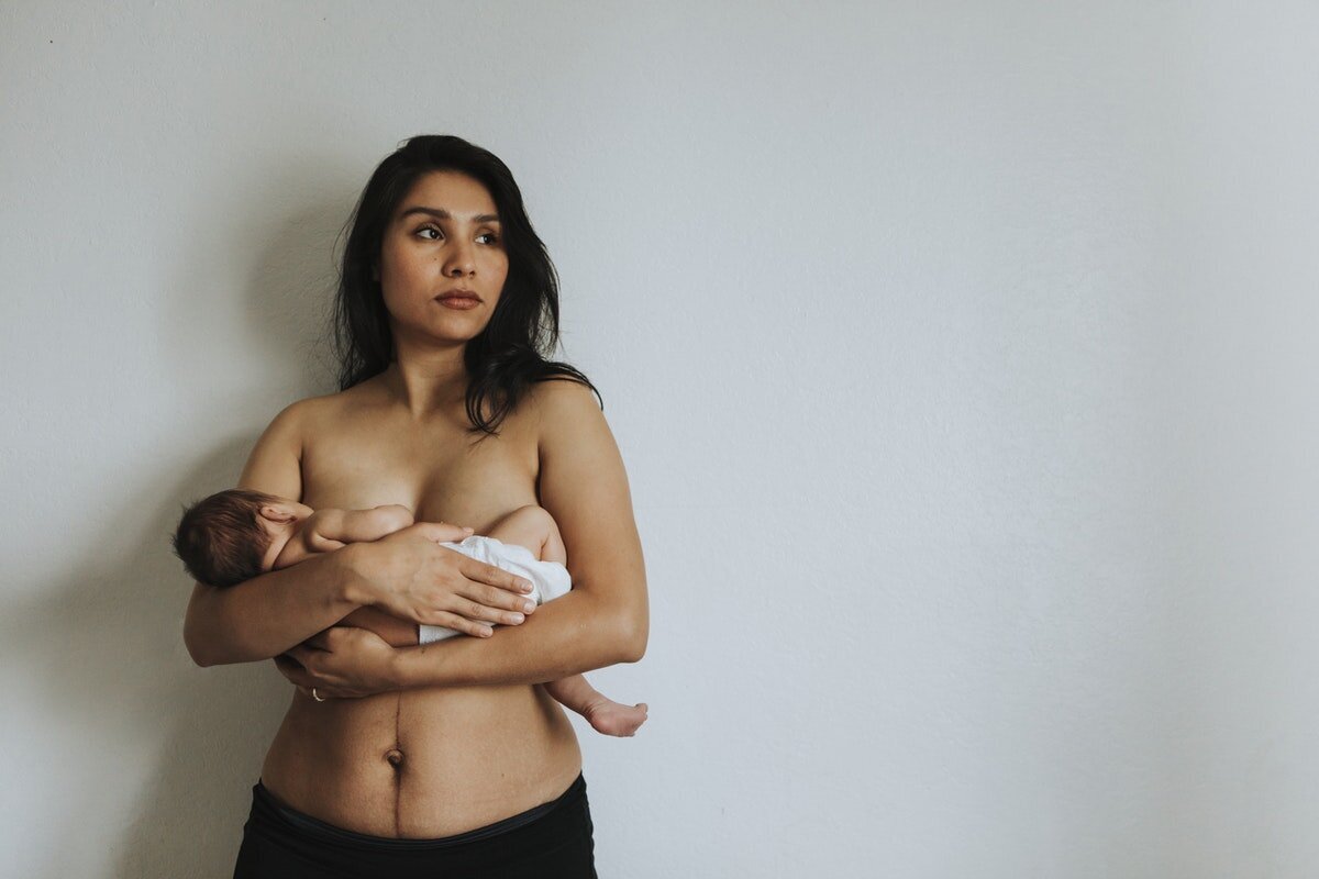 Nudist female breastfeeding