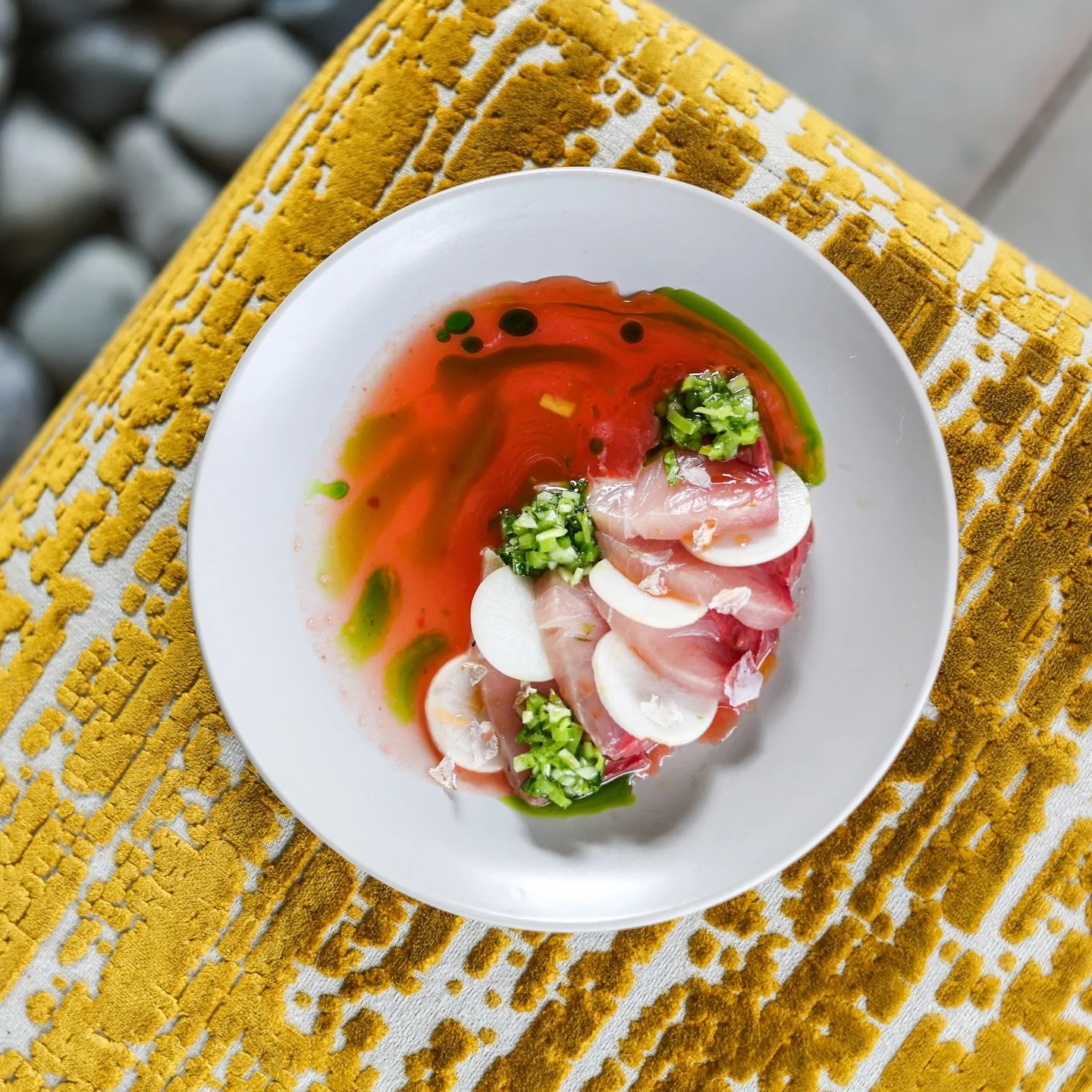 Delicate hamachi meets a tart rhubarb aguachile, layered with crisp hakurei turnip, peppery turnip tops salsa verde, and a quiet hint of strawberry.