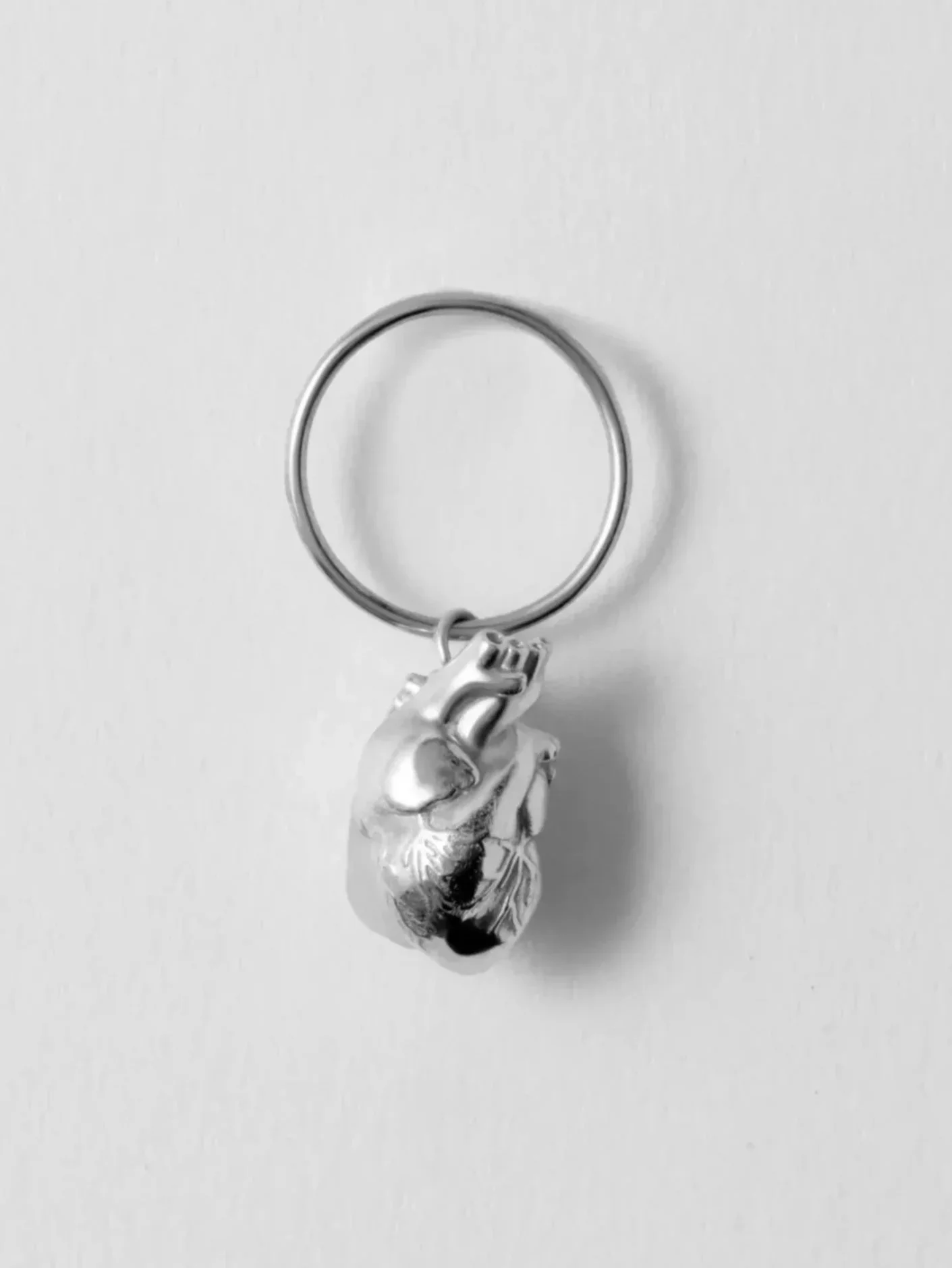 GENEROSITY OF THE HEART CHARM IN SILVER