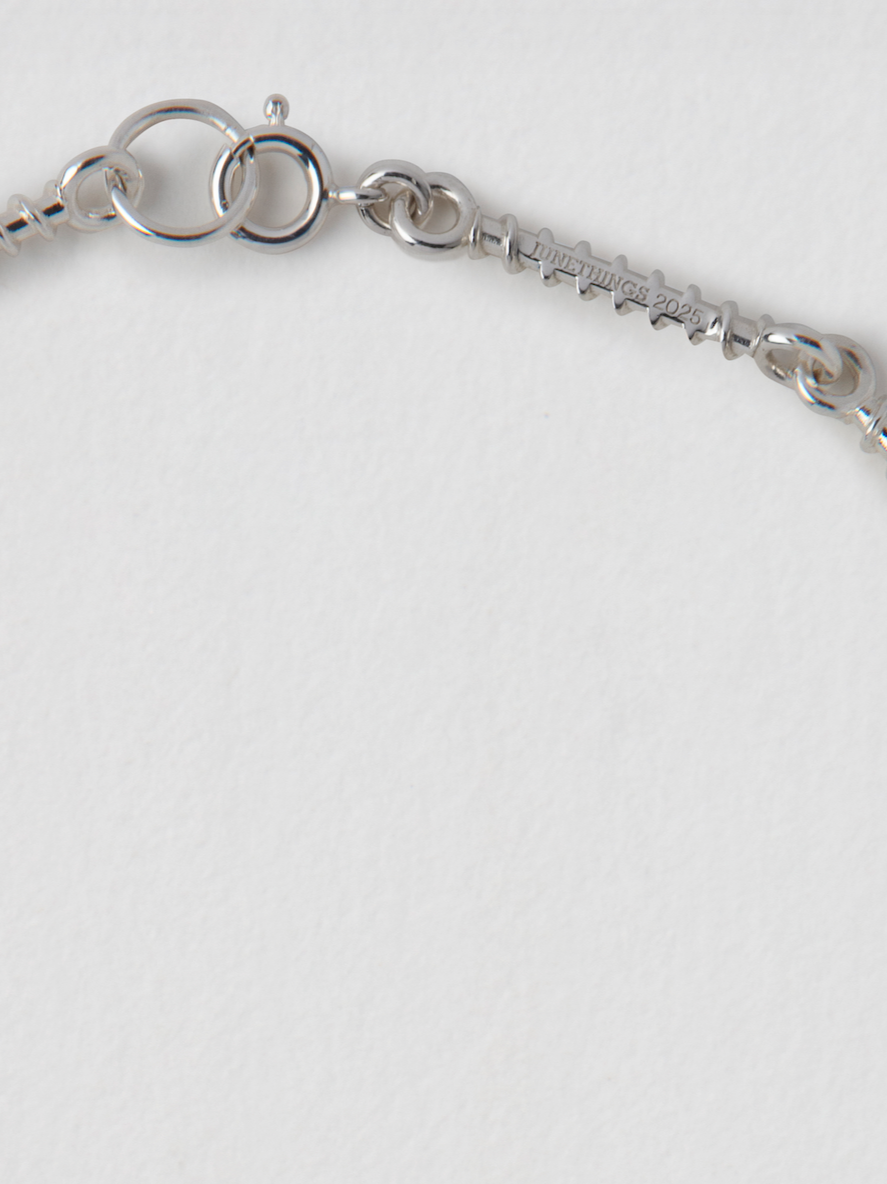 JUNETHINGS_SILVER_SCREW_NECKLACE_FRAGMENT.png