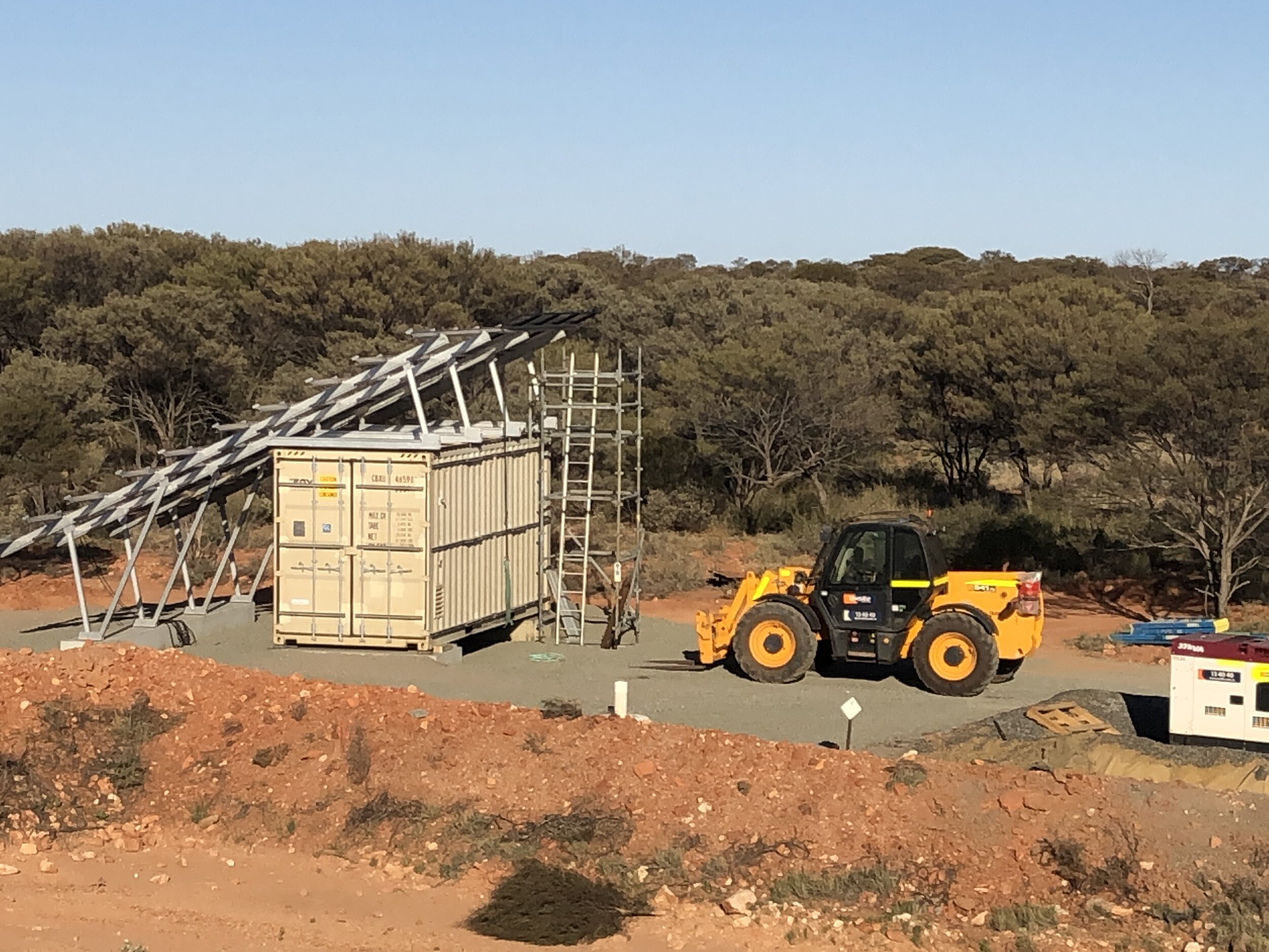 Installation of a transportable off-grid solar hybrid power station in shipping container with integrated batteries and genset, designed and built by AC Change WA