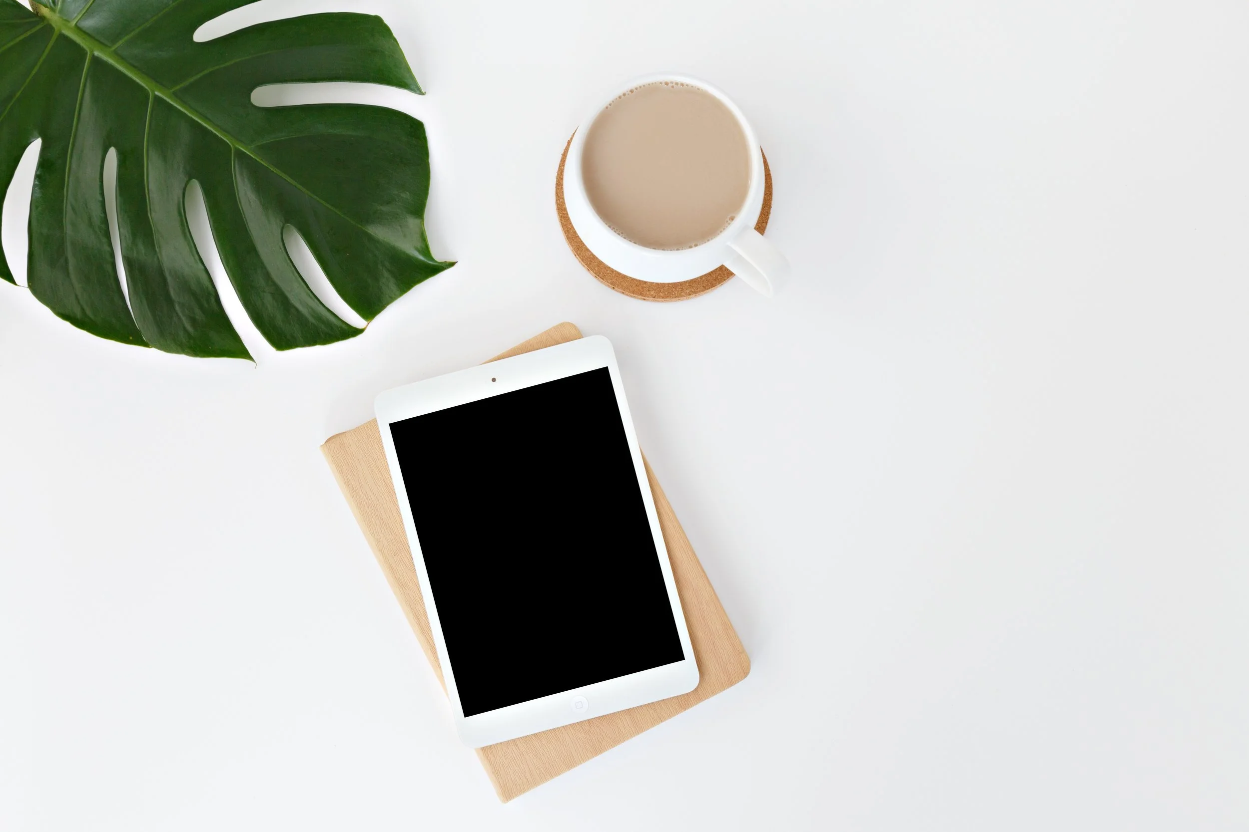 desk-flatlay-with-ipad-and-coffee-by-leone-venter.jpg