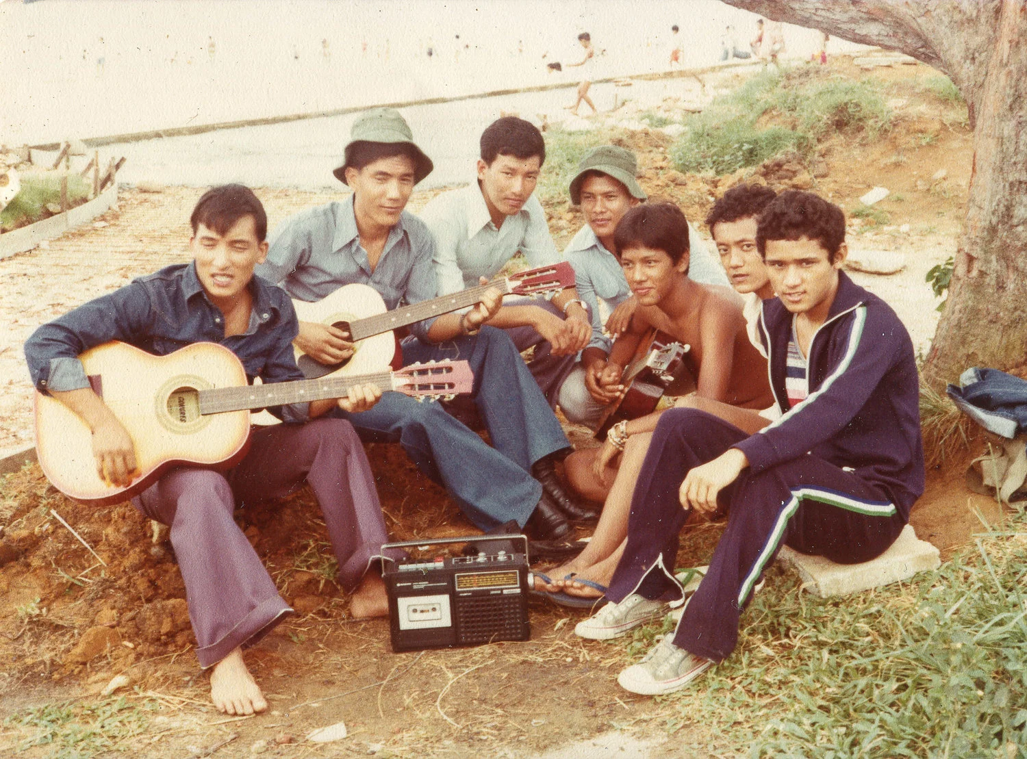With their guitars at Pasir Ris Park, the Singapore Gurkhas and the young Nepali boys in camp sang songs in their own language. Meanwhile, the portable radio was tuned to Hindi songs. Date: 1978. Photo Collection: Krishna Bahadur Gurung / SGPM.