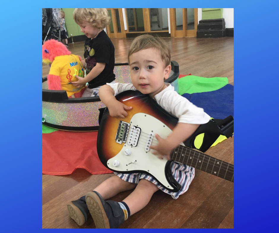 Arlon and guitar.png