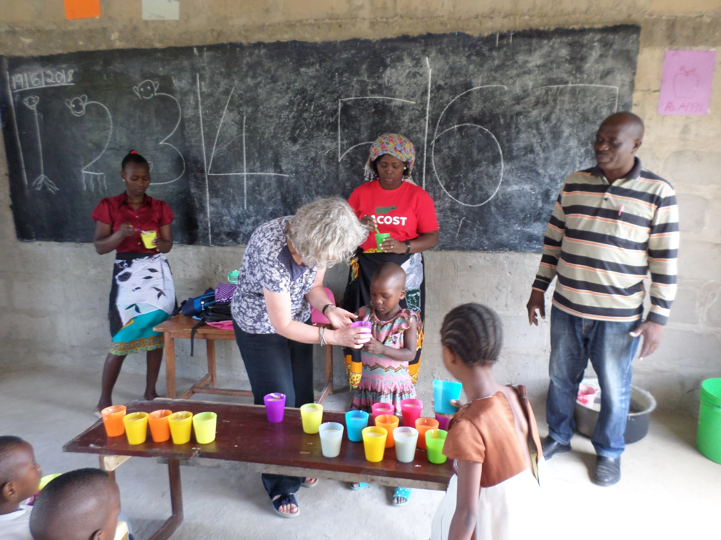 Dee serving Porridge at the Quentin Junior Academy