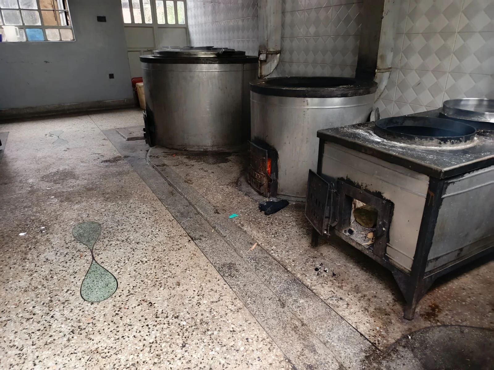 3 large jiko cookers, with large holes in the top which would normally contain cooking pots.