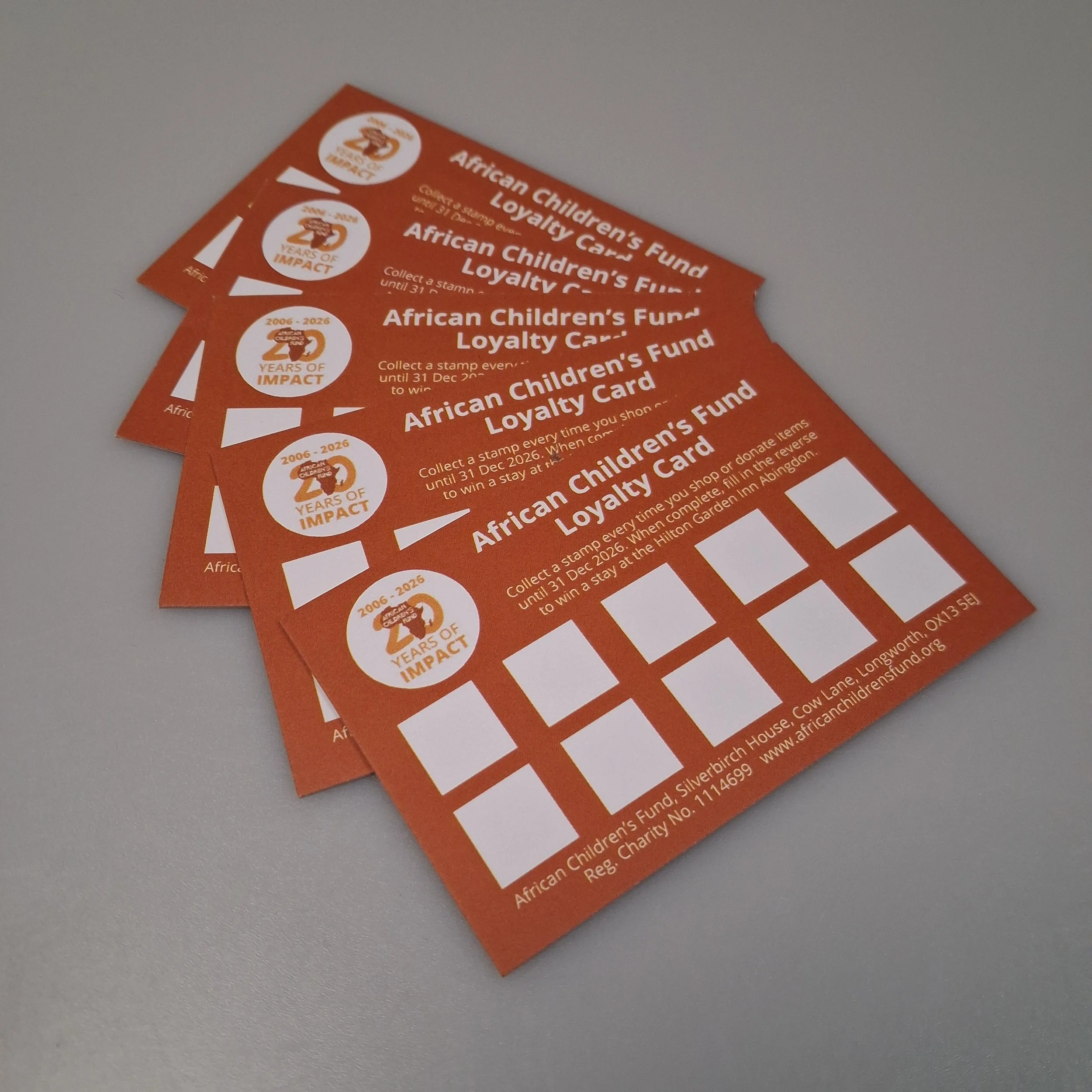 5 African Children's Fund Loyalty Cards, fanned out.
