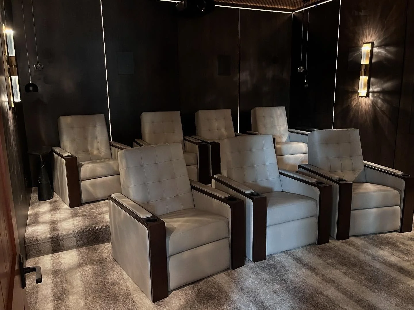 The devil is in the details, but the details are the magic.✨The details in this home theater are also what elevated the space beyond just another theater room. The custom acoustic panels made by the talented team @finelinemillworks were created with 