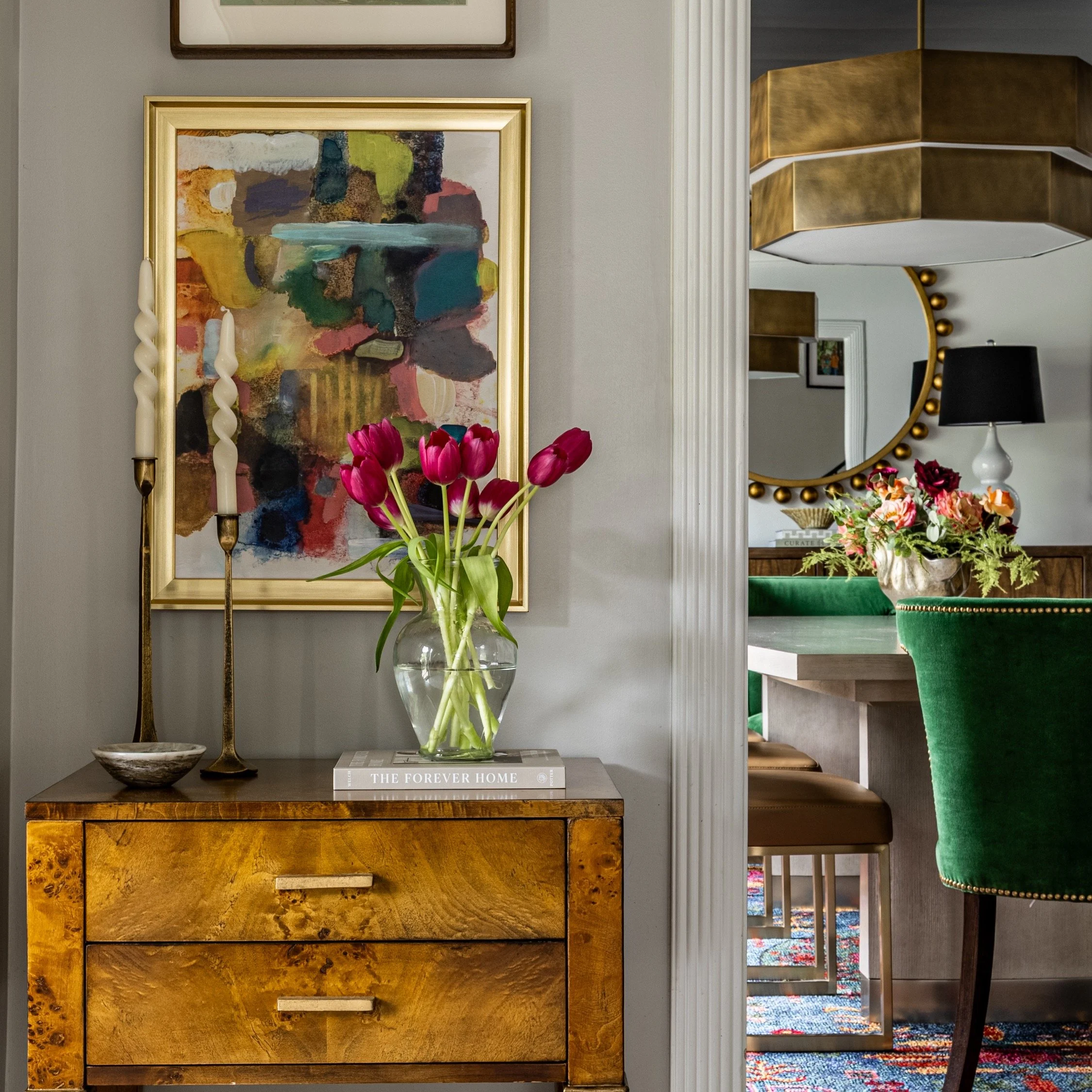 Our Washington project was a fun one! Our clients wanted to update their main level, and their one request was that we incorporate color. . . and A LOT of it! Blues, greens and pinks set the tone, with bold artwork and unexpected accents adding shape