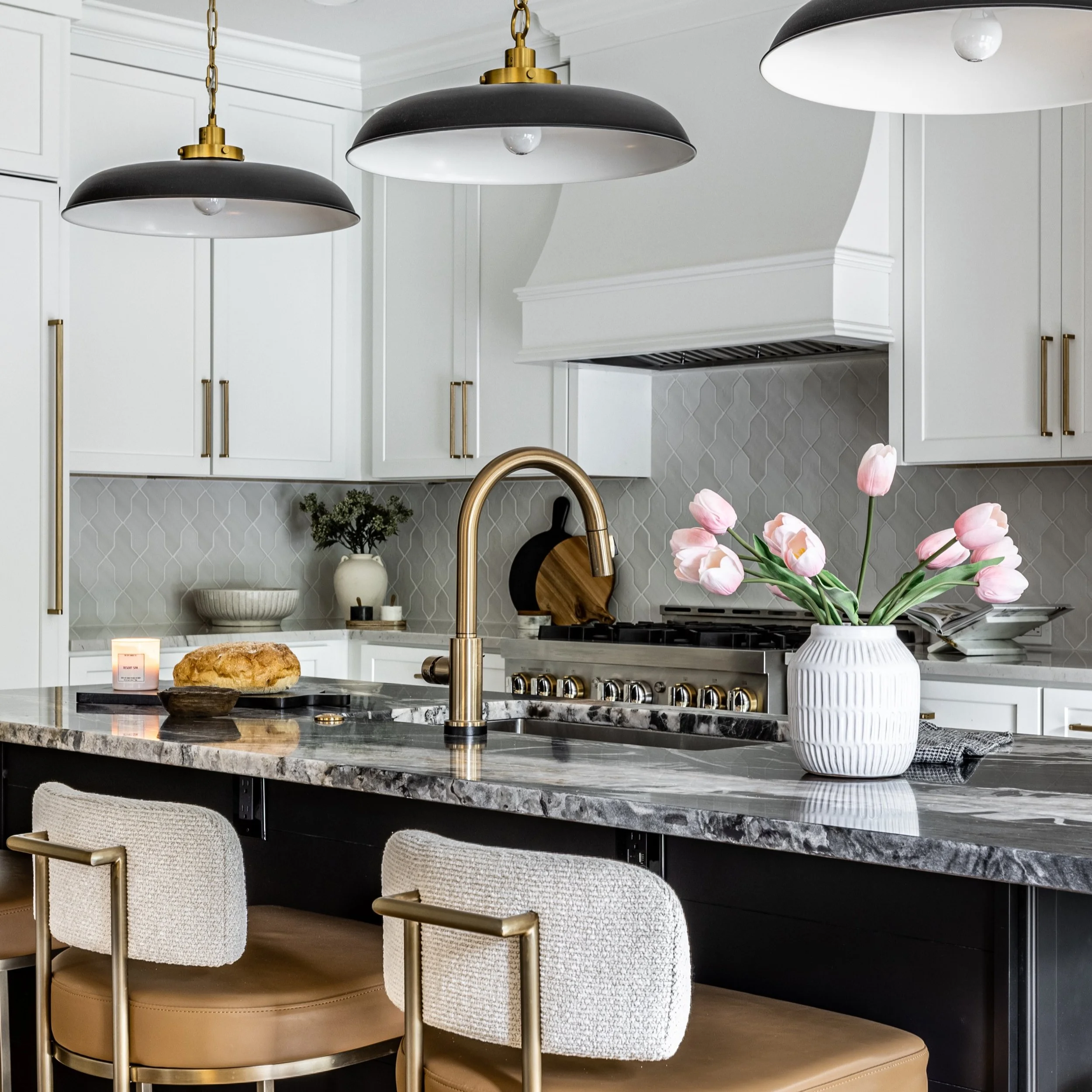 We designed this kitchen and dining room for Friday evenings when the family loves to cook together and hang out. My favorite part is the bar in between the spaces. Complete with a beverage fridge, sink and ice maker, making after dinner cocktails is