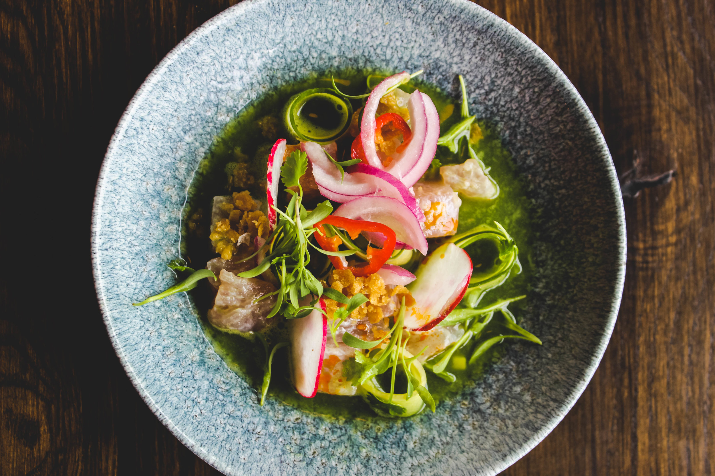 Bird's-eye view of a vibrant ceviche dish.