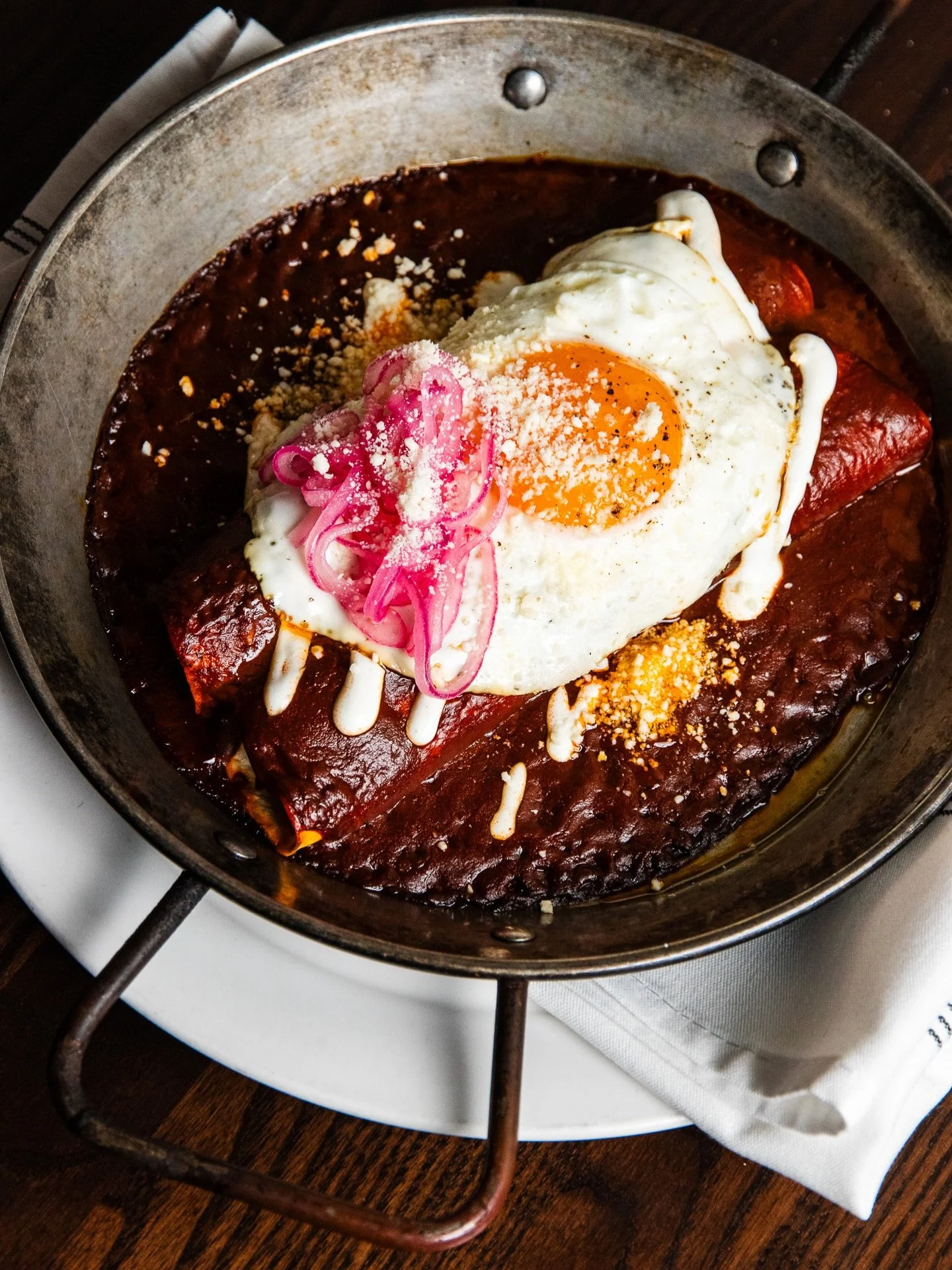 Start your Sunday here 🍳 Duck Enchiladas &bull; chihuahua cheese, cotija cheese, sour cream, fried egg, pickled red onions, corn tortilla #chicagobrunch