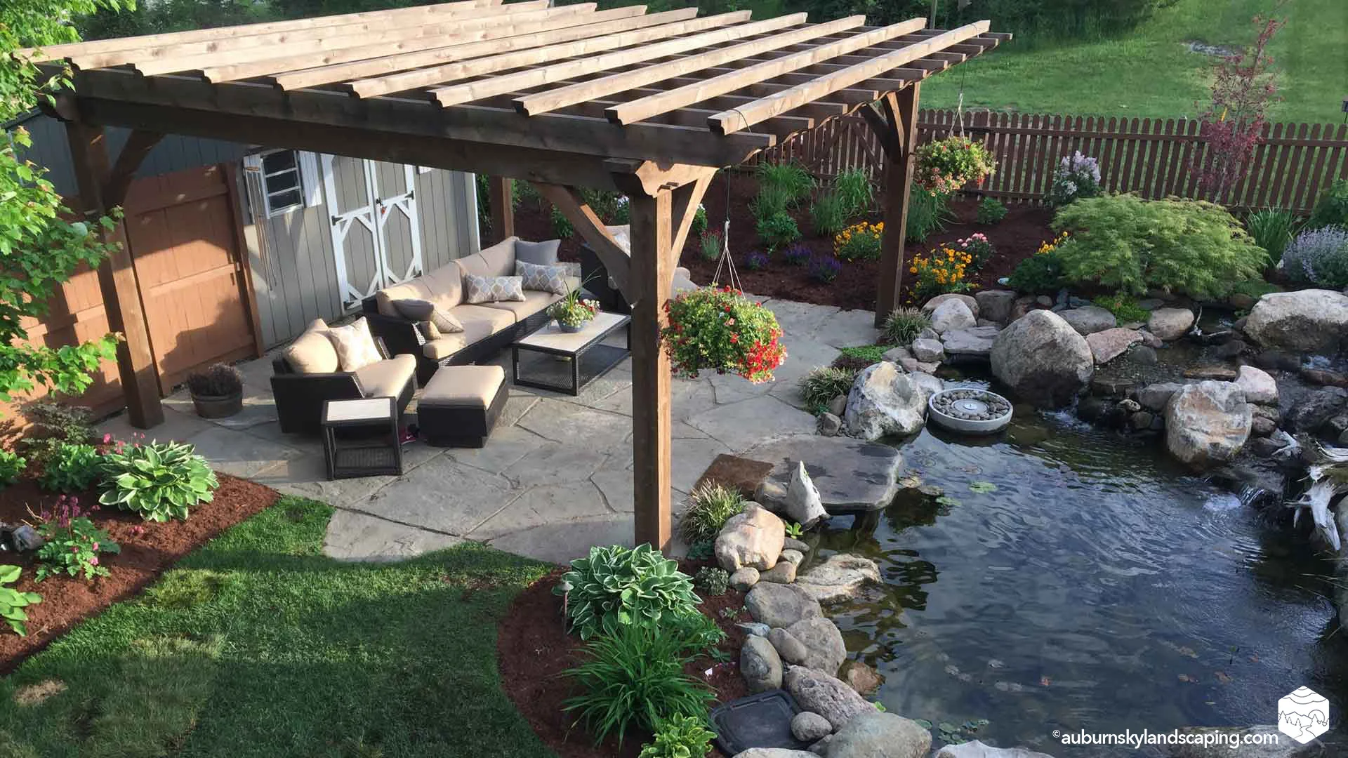 Auburn-Sky-Landscape-Ecosystem-Pond-Natural-Stone-Patio-Pergola.jpg