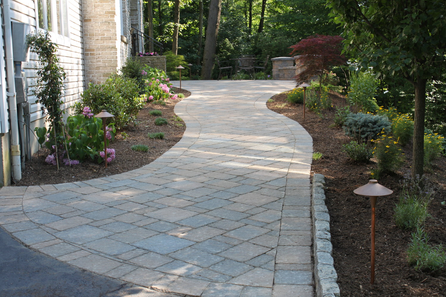 Should I Use Natural Stones Or Pavers For My Patio And Walkway? — Auburn  Sky Landscaping
