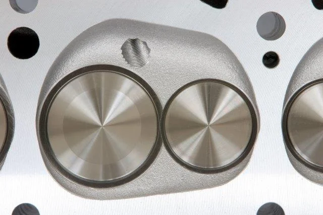 When Edelbrock released its Performer RPM in 1995, the combustion chamber resembled the scallop-shaped, wedge-type chamber that Pontiac utilized. Unlike the stock units, Edelbrock biased the plug toward the exhaust valve, which not only allowed for …