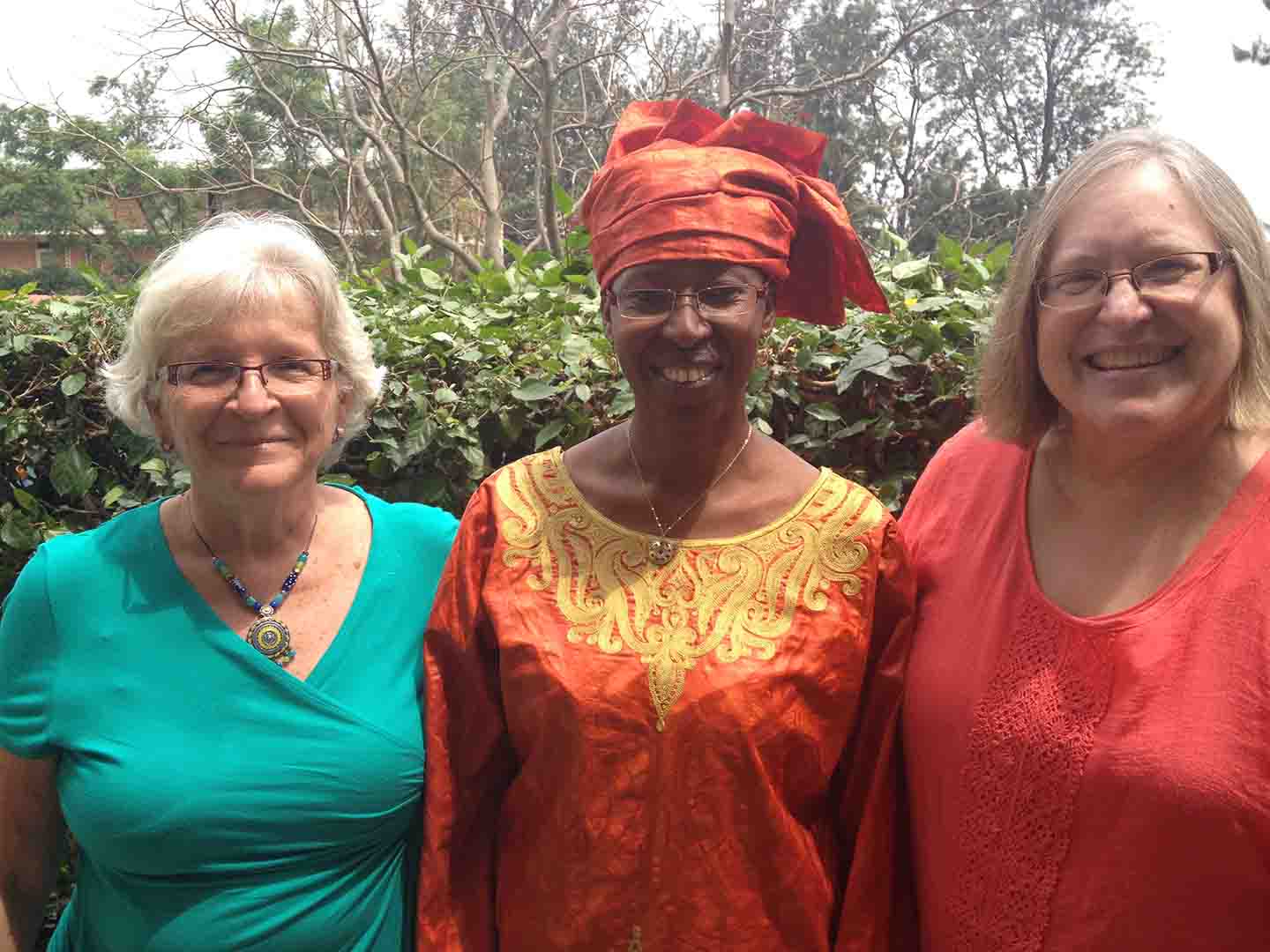 Cairn with her twin at University of Rwanda with the Nursing Dean.JPG