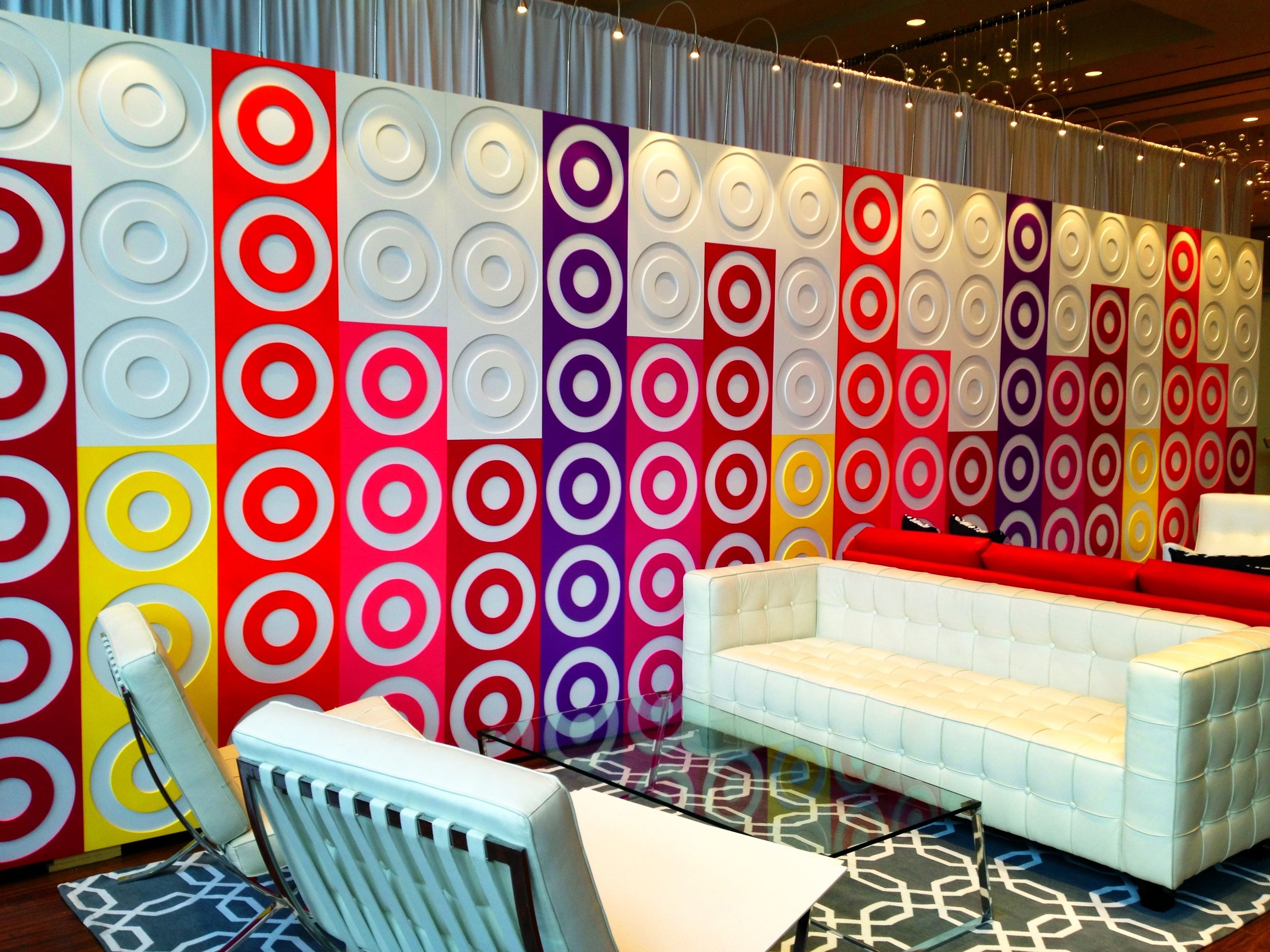 Target lounge with branded wall in bright colors.jpg