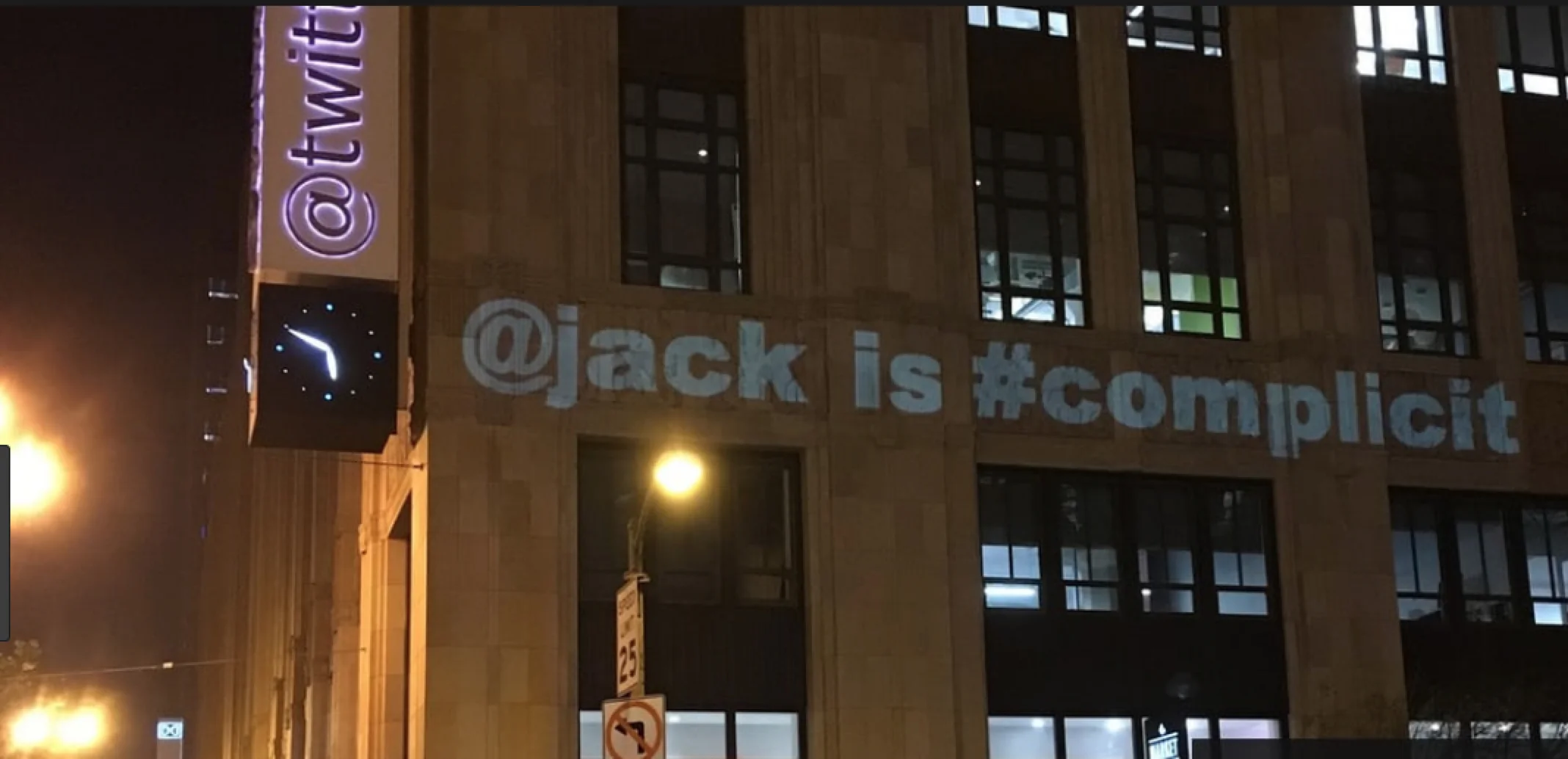 This is known as projection bombing. It is perfectly legal in the United States of America as it falls under the First Amendment right to free speech. At least that was true this morning, but by now, who knows?