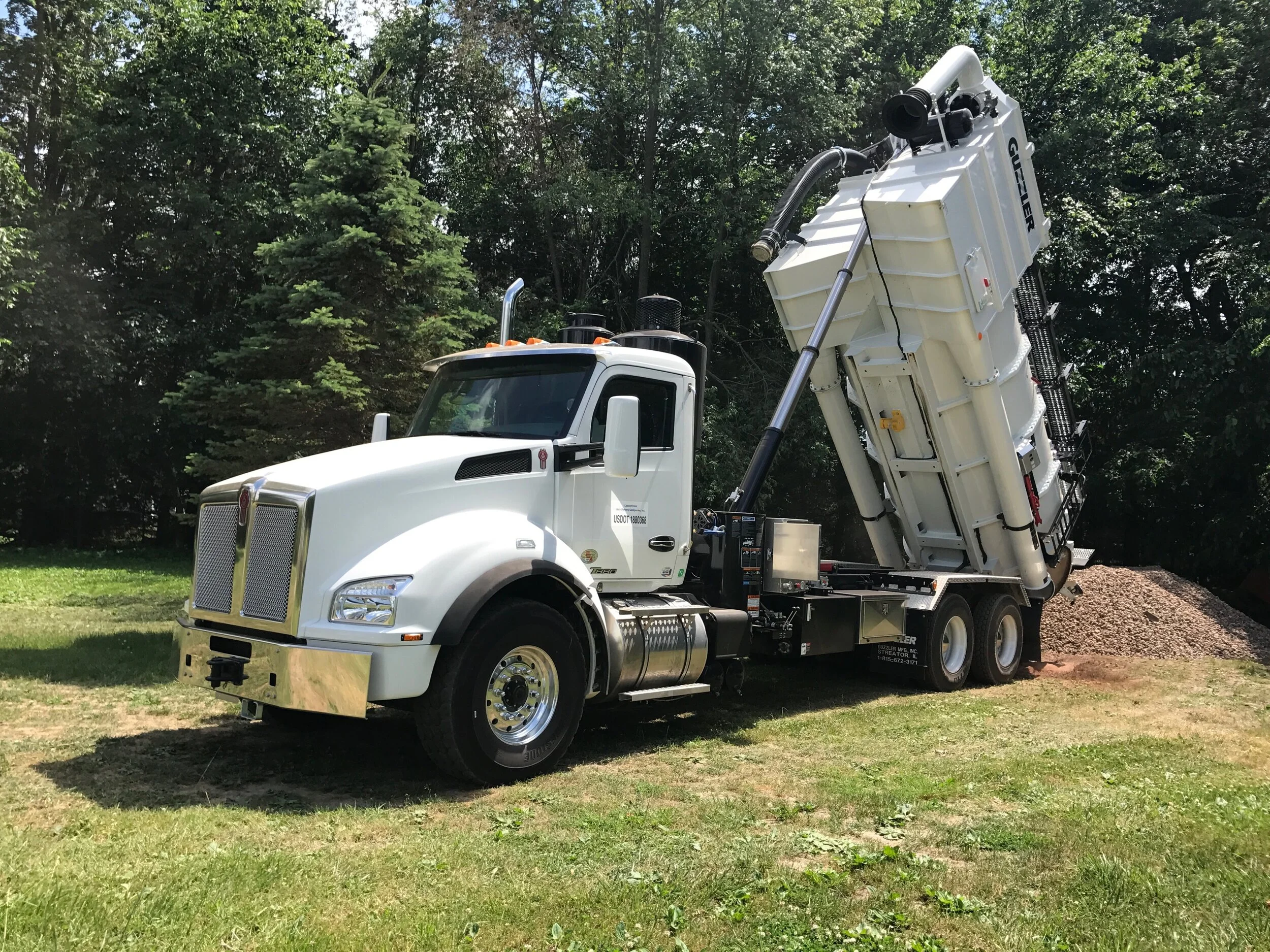 White Guzzler dumping rocks.JPG