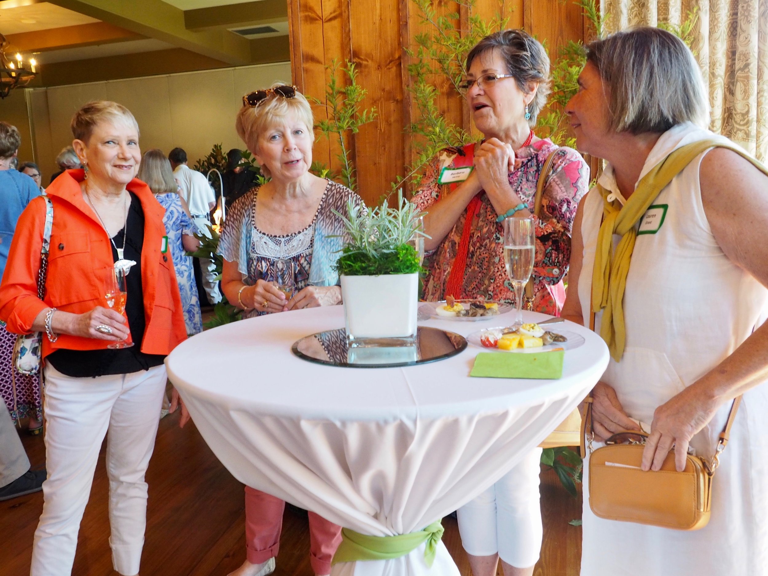 Vicki Lewis, Carolyn Littell, Barbara Henry and Lauren Grant enjoy champagne, nibbles and a good WFB memory.