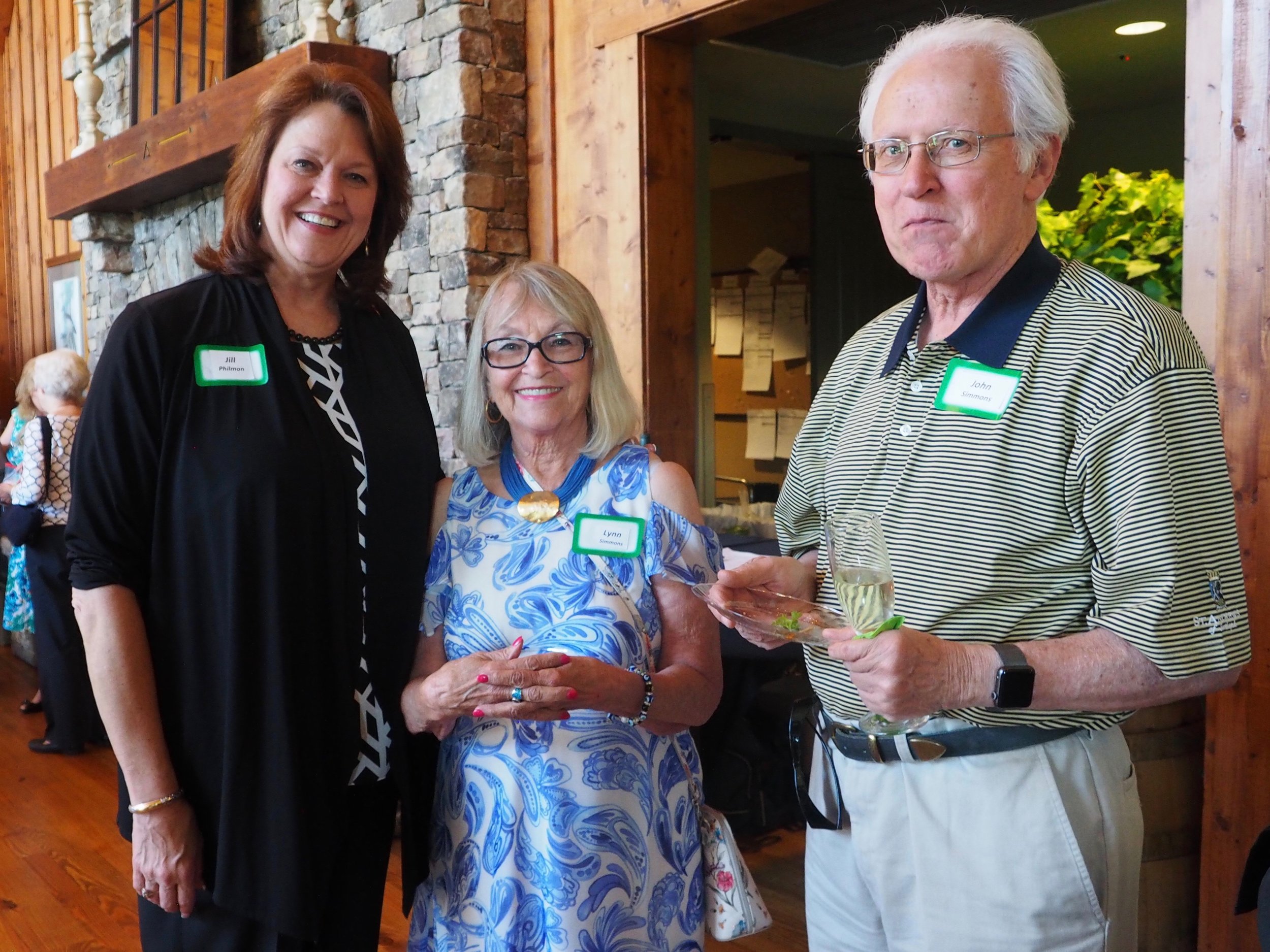 Jill Philmon, Big Canoe general manager, left, with Lynn and John Simmons.