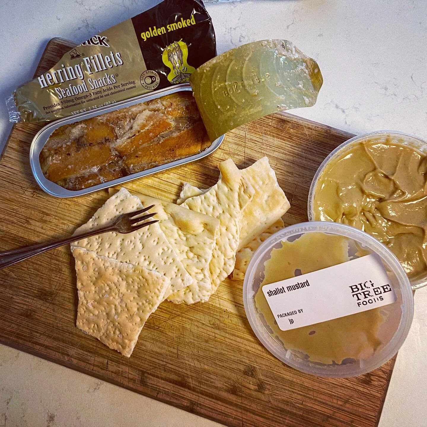 Upgraded my favorite tinned fish snack today with house made saltine crackers and shallot mustard, both from @bigtreegrocery.