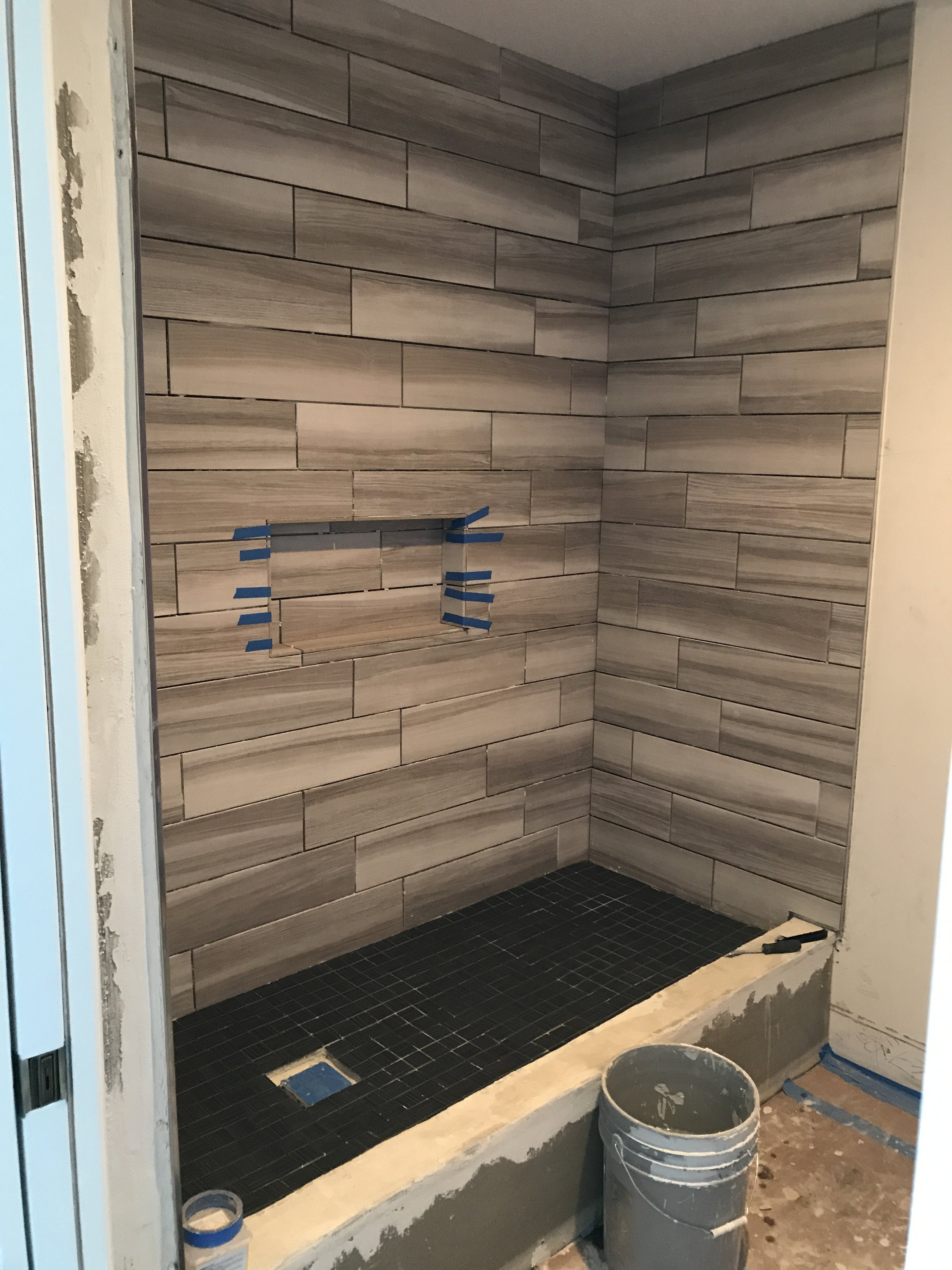 Tile walls and floor finished ready for grout