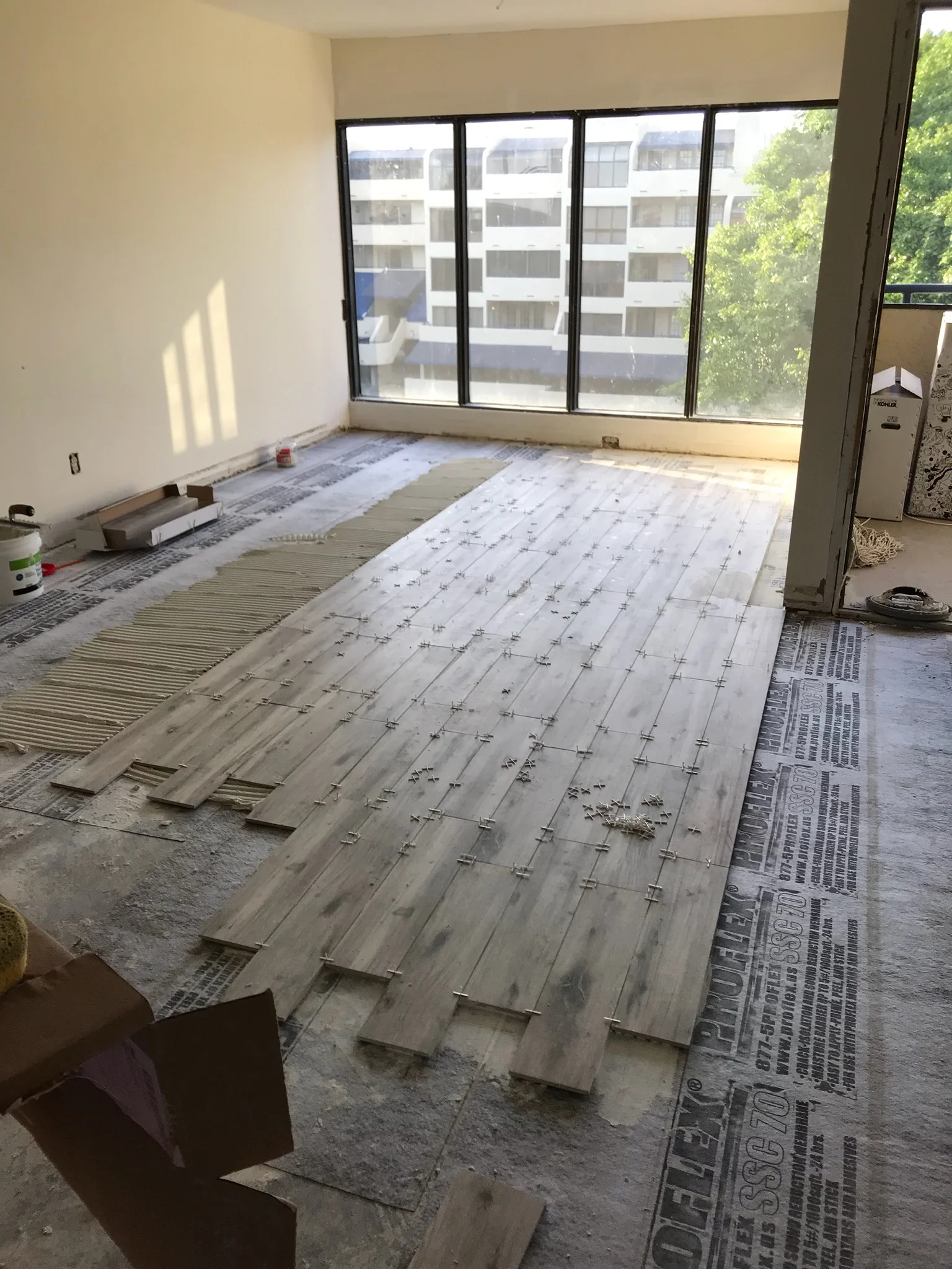 Wood plank tile floor in progress