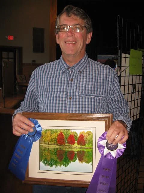 Warren Calvert, winner of People's Choice in photography with Autumn on Crystal Lake. The picture also received 1st place in Scenes of Lexington photography category.