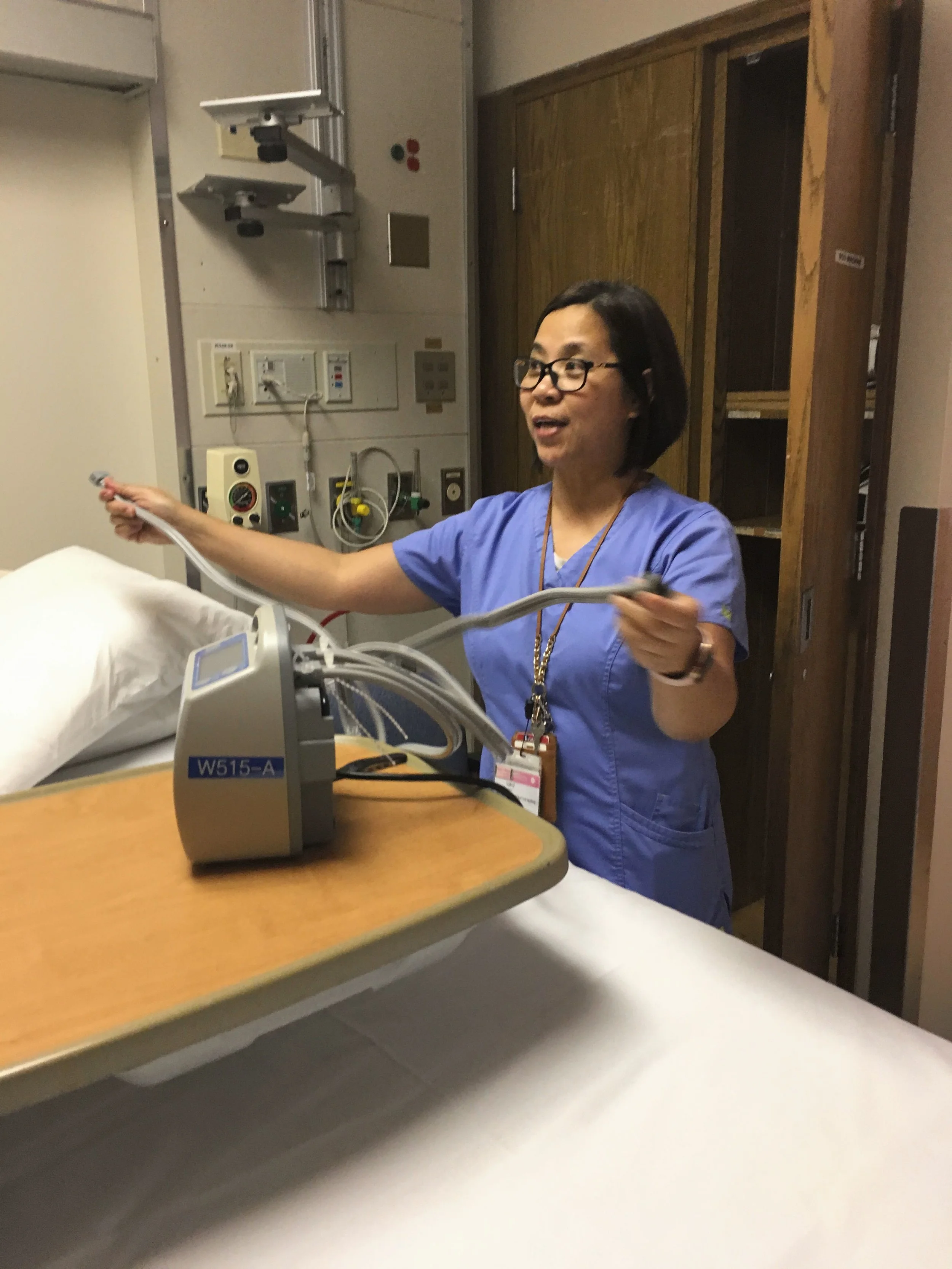 Nurse with SCD machine.JPG