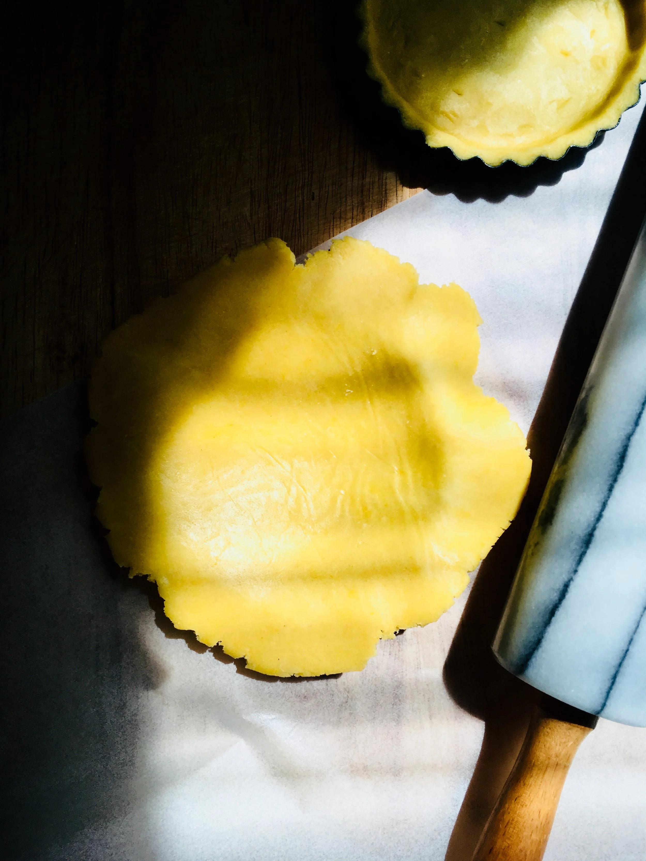 2. Peel off one piece of paper and flip onto your tin using the other piece