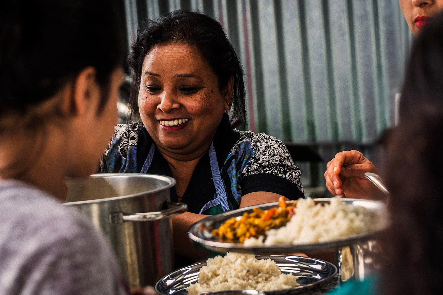 Jivanas-Lunch-Food-Serving-Woman-Rice-Smile-Eating_small.jpg