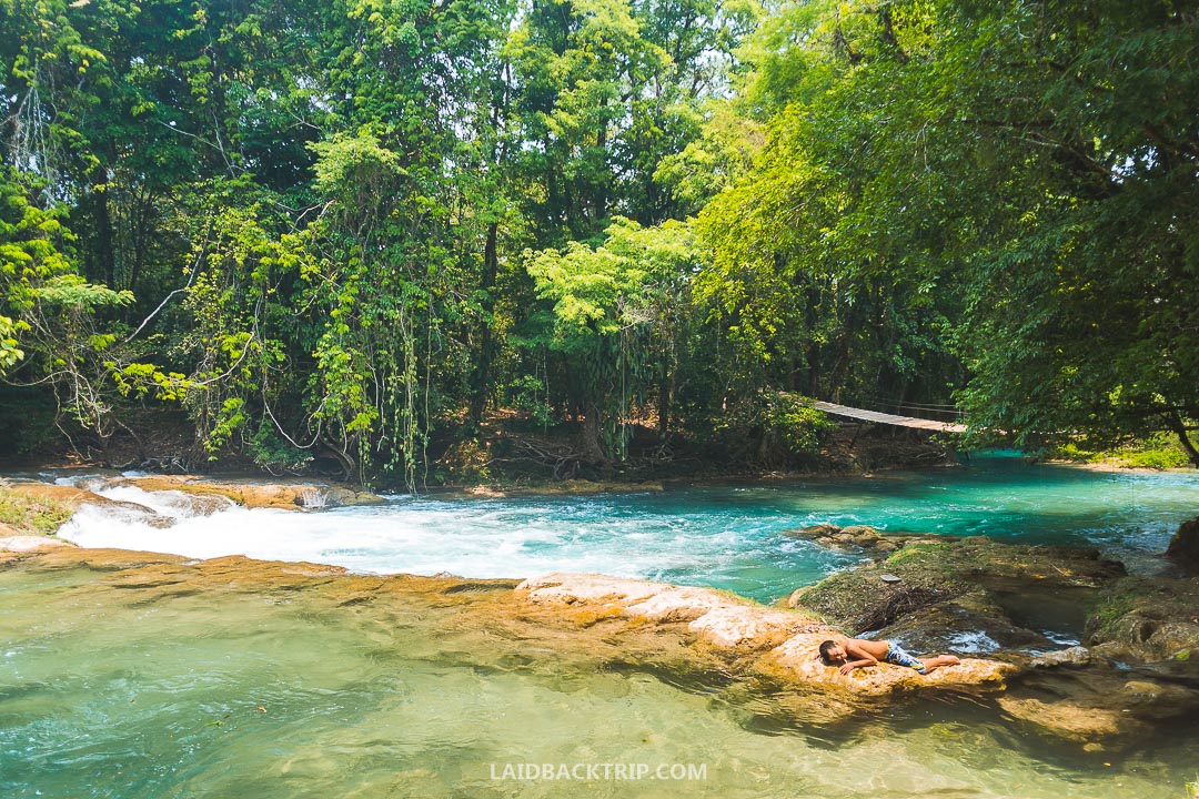 You can stay in Palenque overnight before visiting Agua Azul.