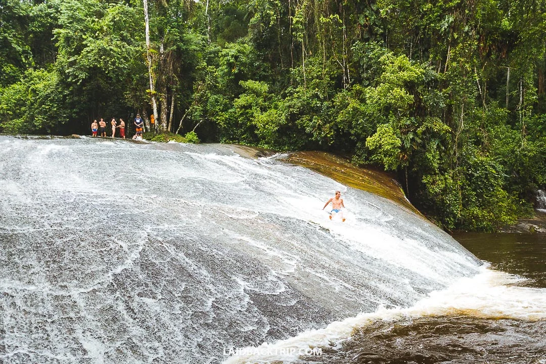 Sliding down the waterfall is a fun activity to do.