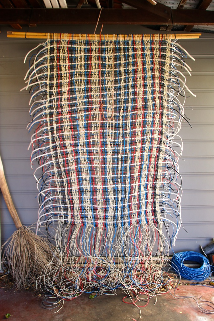  TITLE:&nbsp; Unfinished business  MEDIUM: Electrical wire weaving DIMENSIONS: H280 x W150cm 