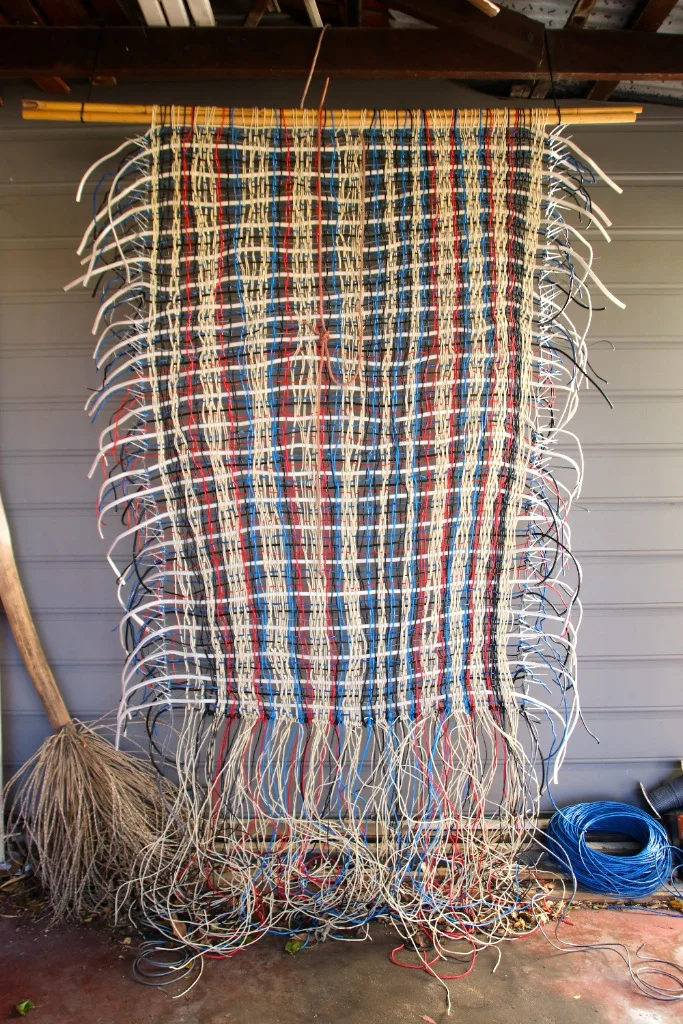 TITLE: Unfinished business MEDIUM: Electrical wire weaving DIMENSIONS: H280 x W150cm
