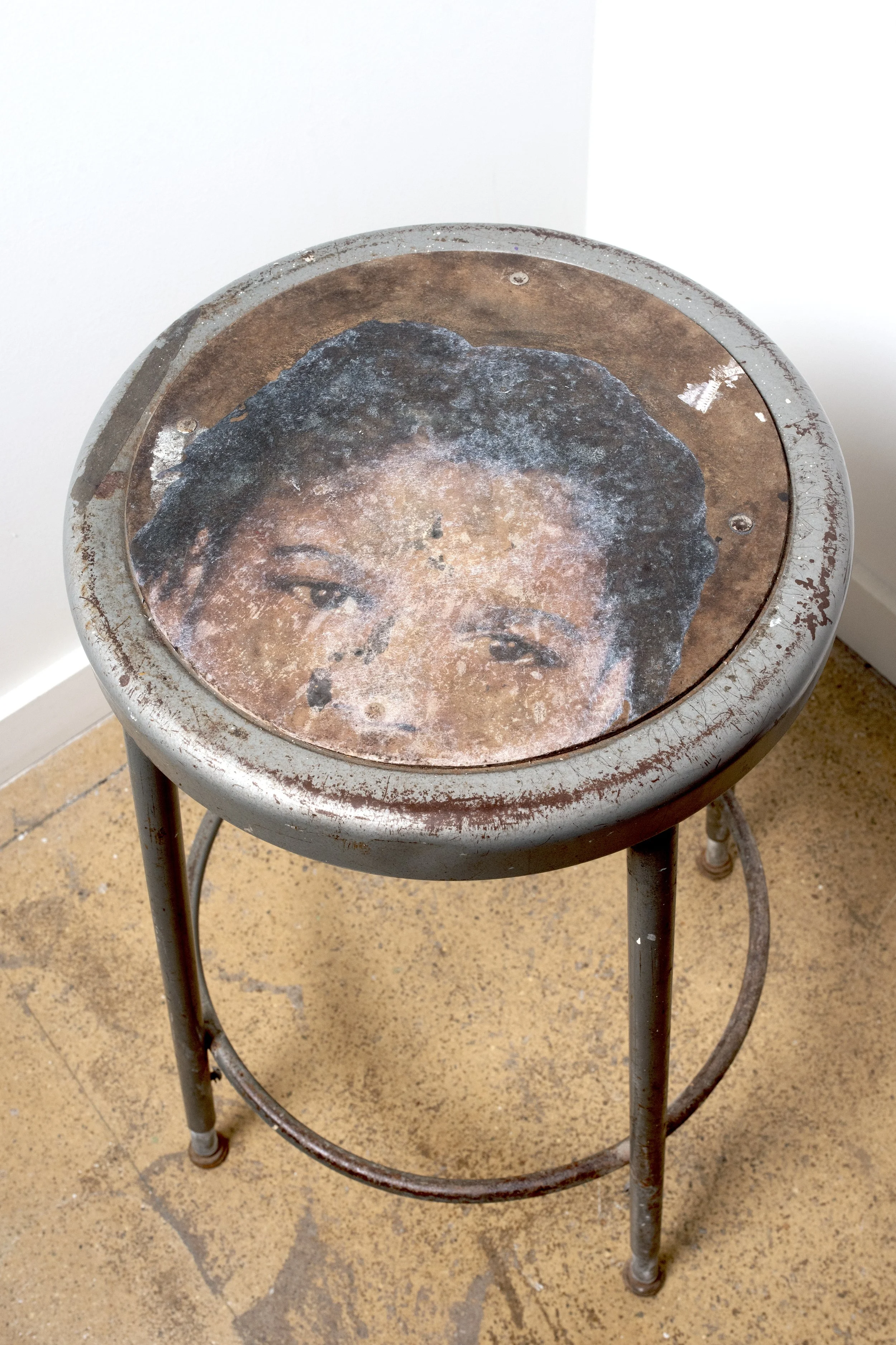 Picture Day (2024) 13.5" x 27" (metal stool, bond paper, matte gel medium) This stool features an image transfer of myself, taken on picture day in kindergarten ('93). I deliberately chose this picture to transfer because I wanted my brown